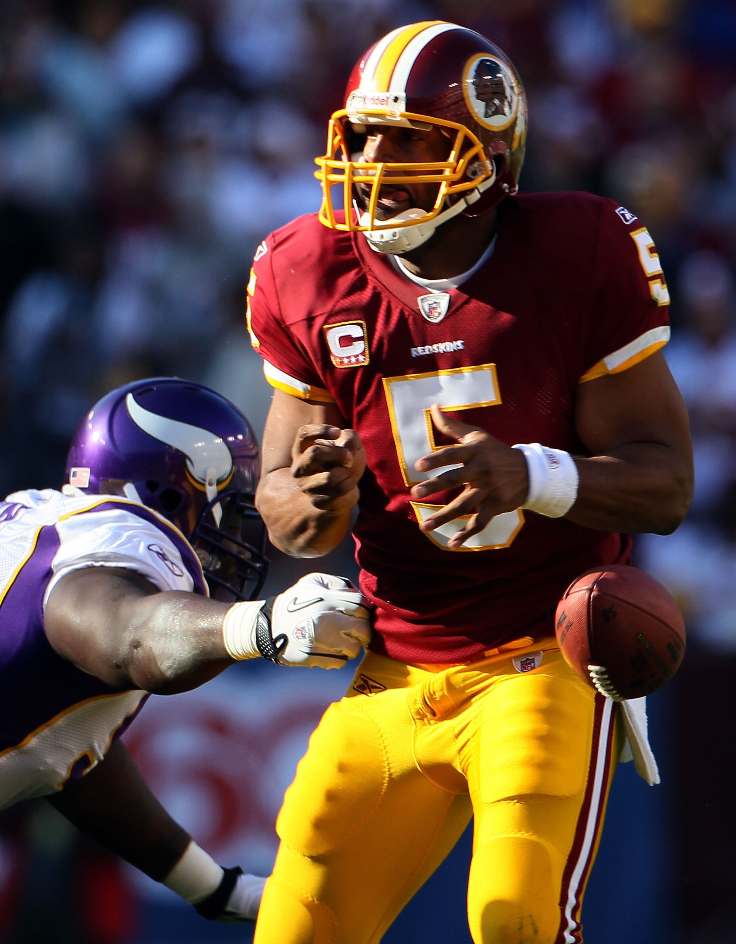 LANDOVER, MD - NOVEMBER 28:  Quarterback Donovan McNabb fumbles the ball while getting hit in the pocket against the Minnesota Vikings at FedExField November 28, 2010 in Landover, Maryland. The Vikings won the game 17-13.  (Photo by Win McNamee/Getty Imag