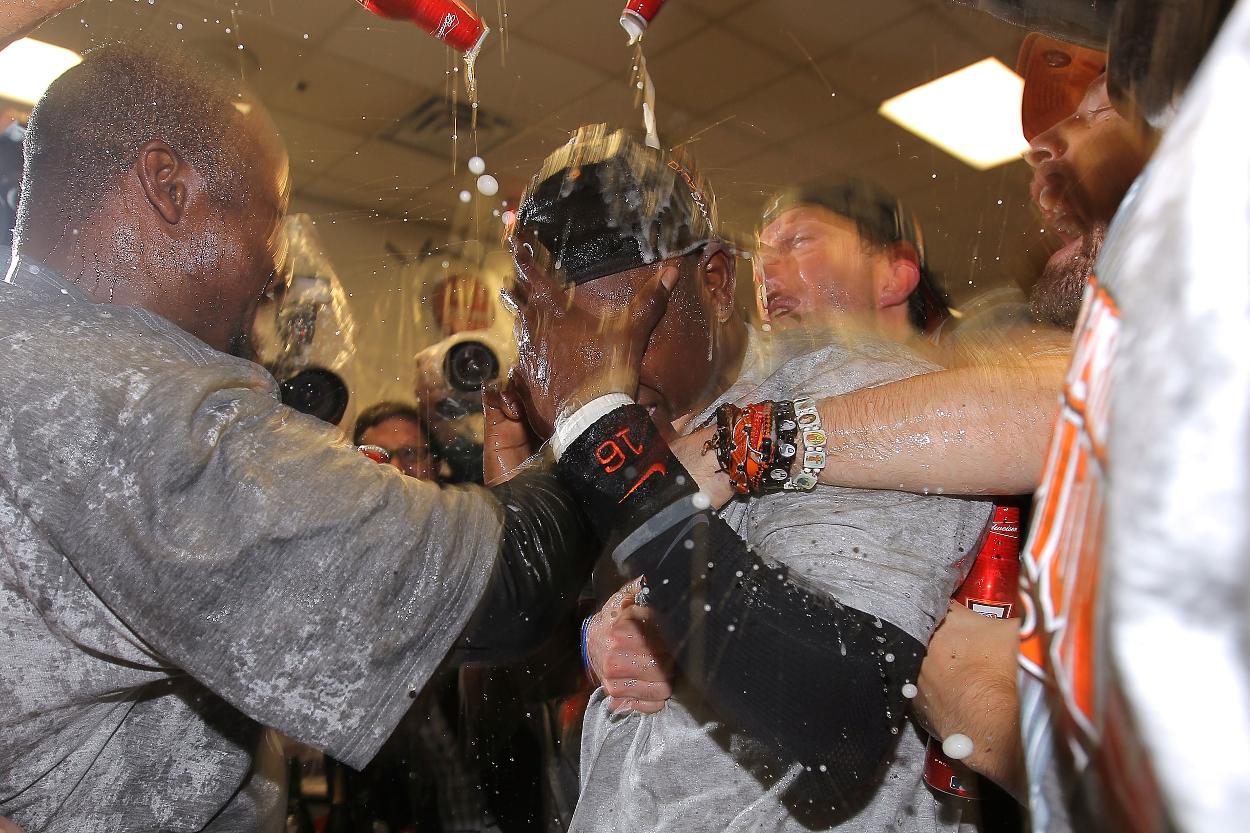ARLINGTON, TX - NOVEMBER 01:  Edgar Renteria #16 of the San Francisco Giants celebrates with his teammates in the locker room after the Giants won 3-1 against the Texas Rangers in Game Five of the 2010 MLB World Series at Rangers Ballpark in Arlington on