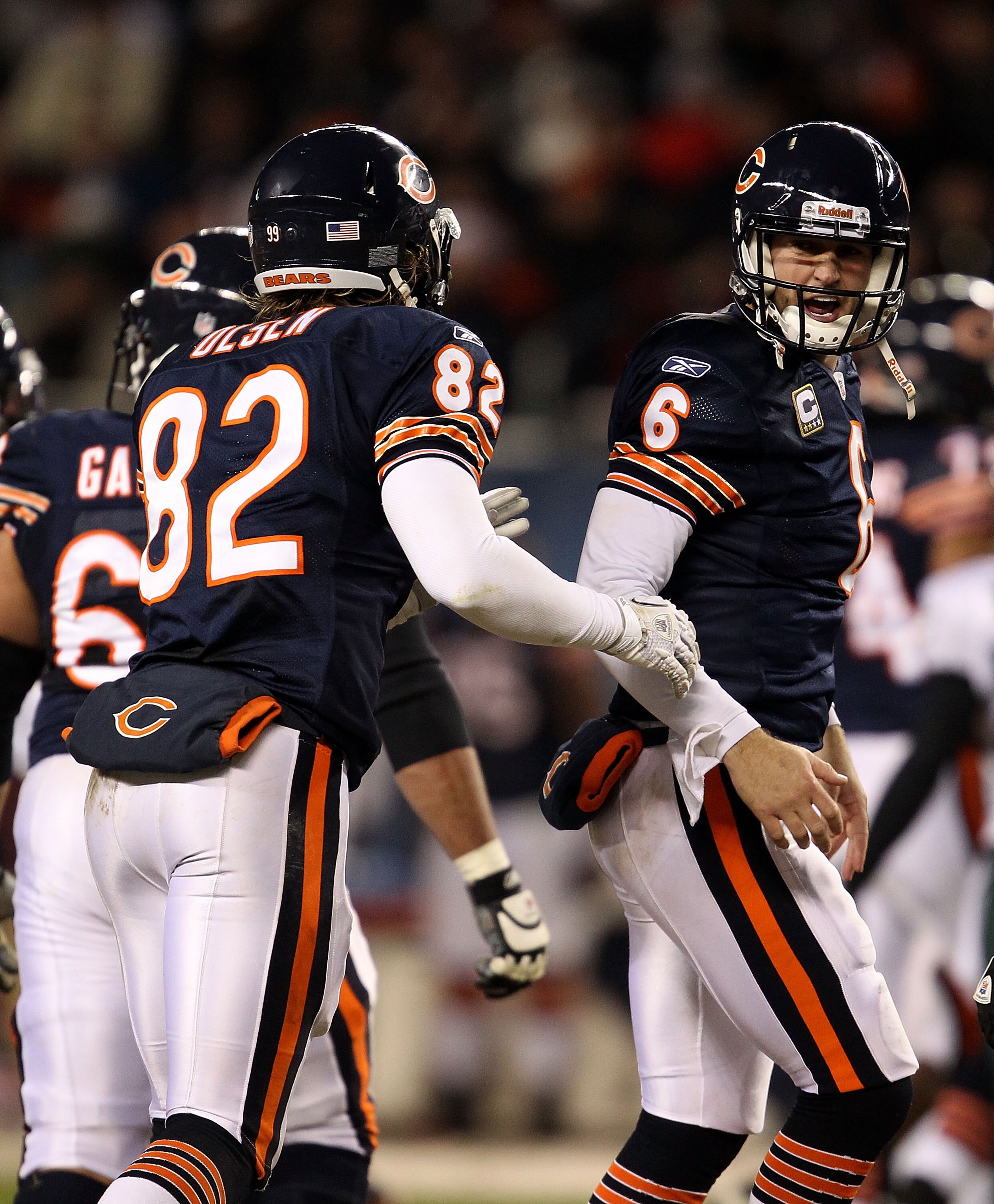 CHICAGO - NOVEMBER 28: Greg Olsen #82 of the Chicago Bears ushers teammate Jay Cutler #6 off of the field as Cutler yells at a referee against the Philadelphia Eagles at Soldier Field on November 28, 2010 in Chicago, Illinois. The Bears defeated the Eagle