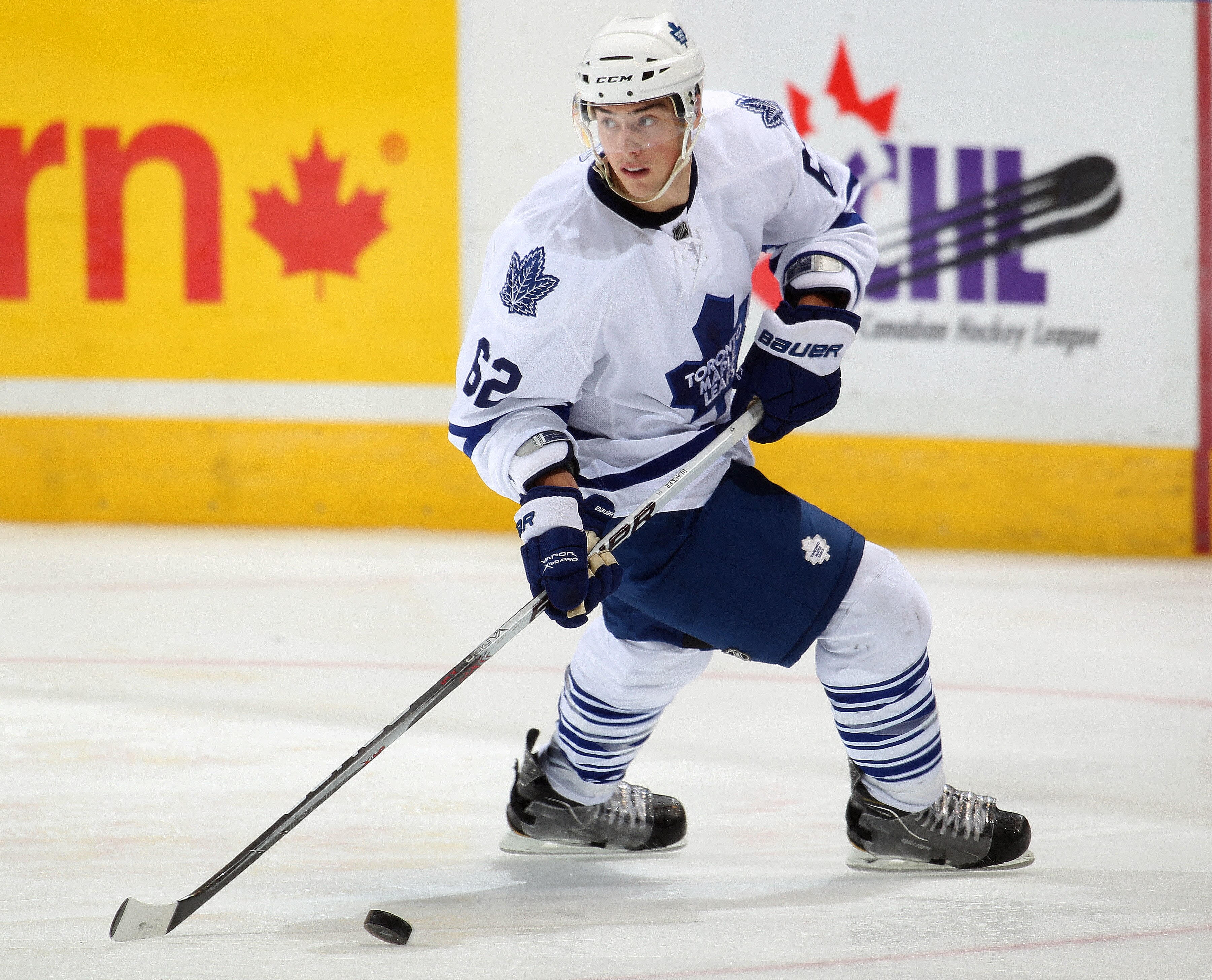 LONDON, CANADA - SEPTEMBER 11:  Jesse Blacker #62 of the Toronto Maple Leafs skates with the puck in a game against the Chicago Black Hawks during the NHL Rookie Tournament on September 11,2010 at the John Labatt Centre in London,Ontario. The Leafs defeat