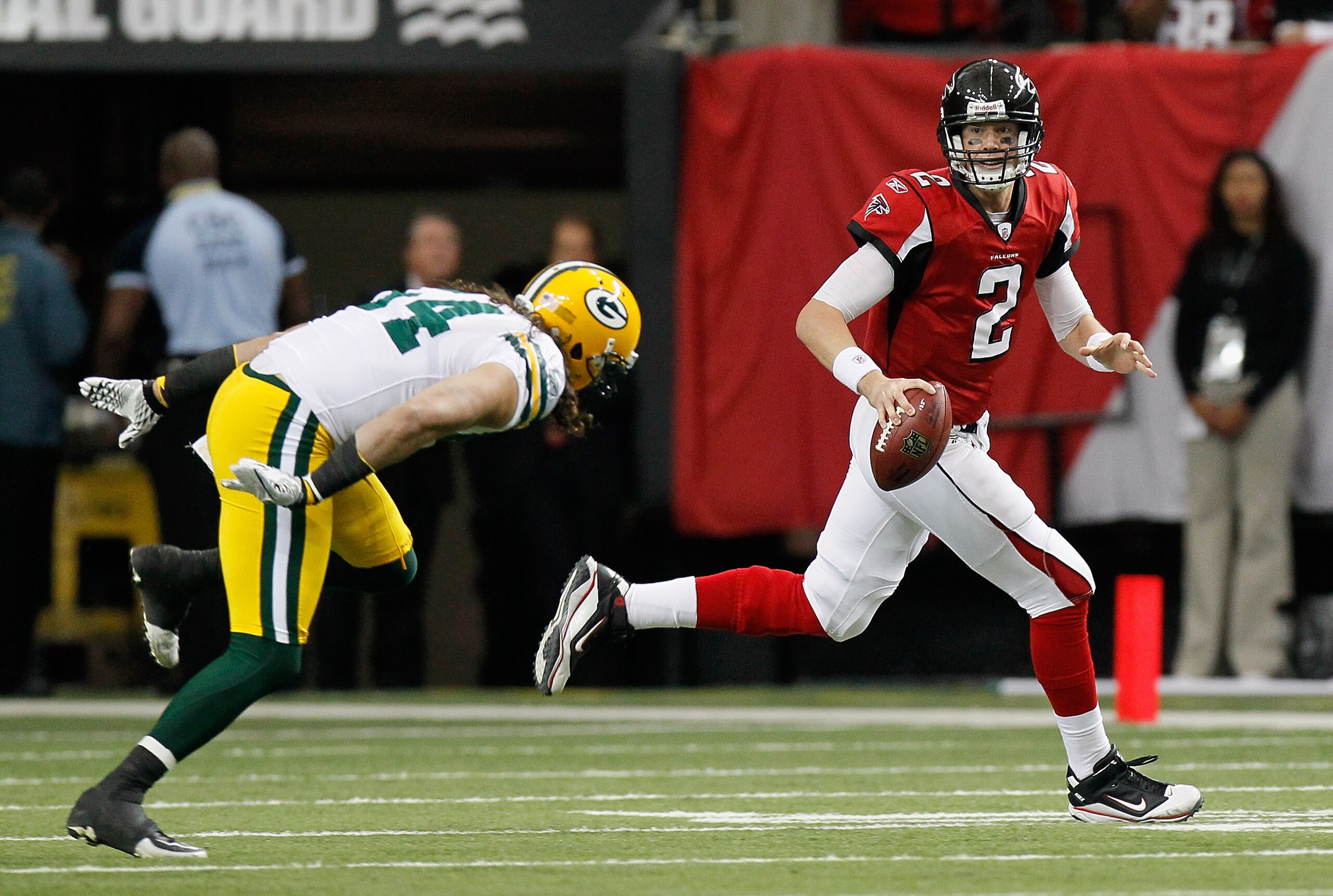ATLANTA - NOVEMBER 28:  Quarterback Matt Ryan #2 of the Atlanta Falcons rushes out of the pocket away from Brandon Chillar #54 of the Green Bay Packers at Georgia Dome on November 28, 2010 in Atlanta, Georgia.  (Photo by Kevin C. Cox/Getty Images)