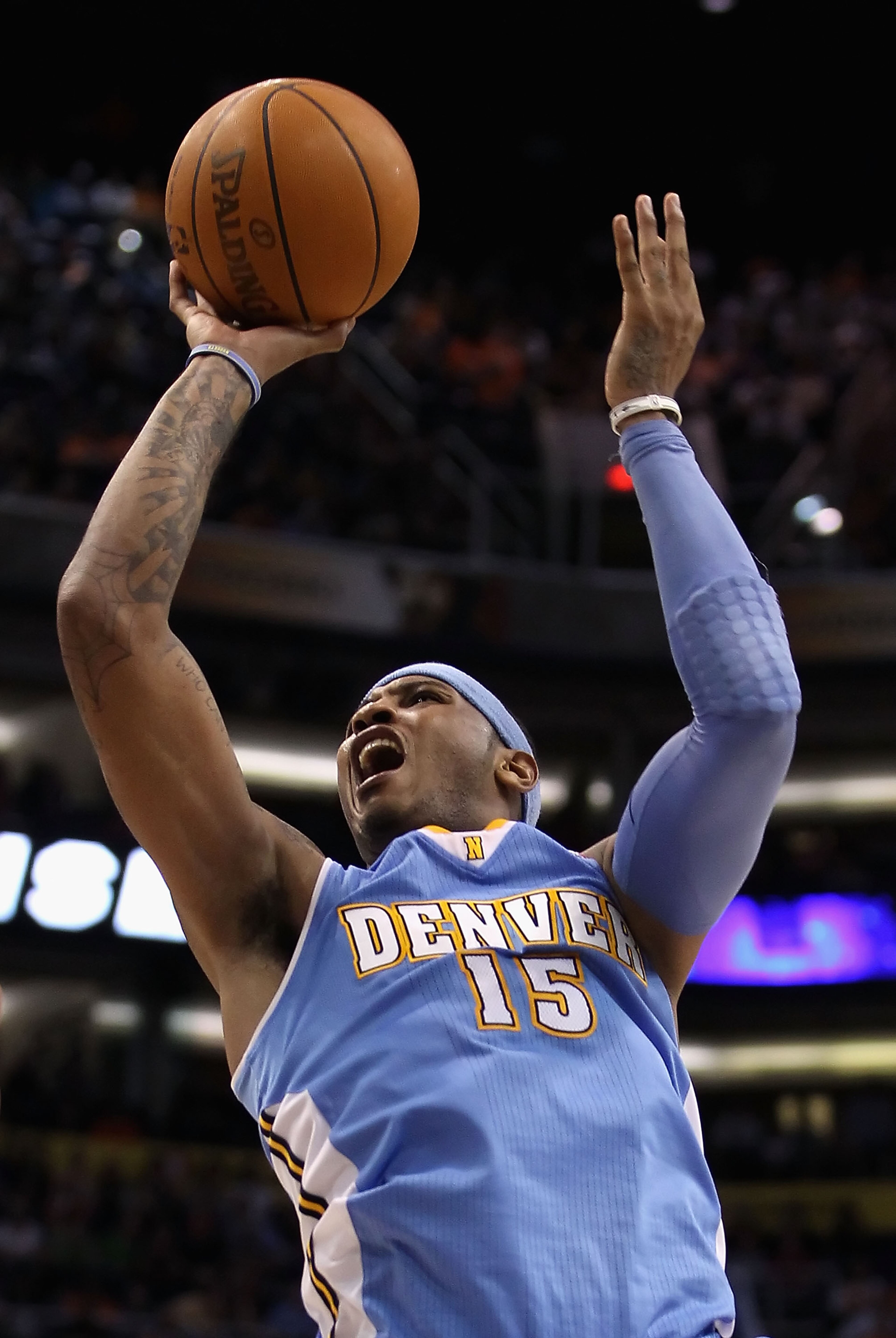 PHOENIX - NOVEMBER 15: Carmelo Anthony #15 of the Denver Nuggets puts up a shot during the NBA game against the Phoenix Suns at US Airways Center on November 15, 2010 in Phoenix, Arizona. The Suns defeated the Nuggets 100-94. NOTE TO USER: User express PHOENIX - NOVEMBER 15: Carmelo Anthony #15 of the Denver Nuggets puts up a shot during the NBA game against the Phoenix Suns at US Airways Center on November 15, 2010 in Phoenix, Arizona. The Suns defeated the Nuggets 100-94. NOTE TO USER: User express