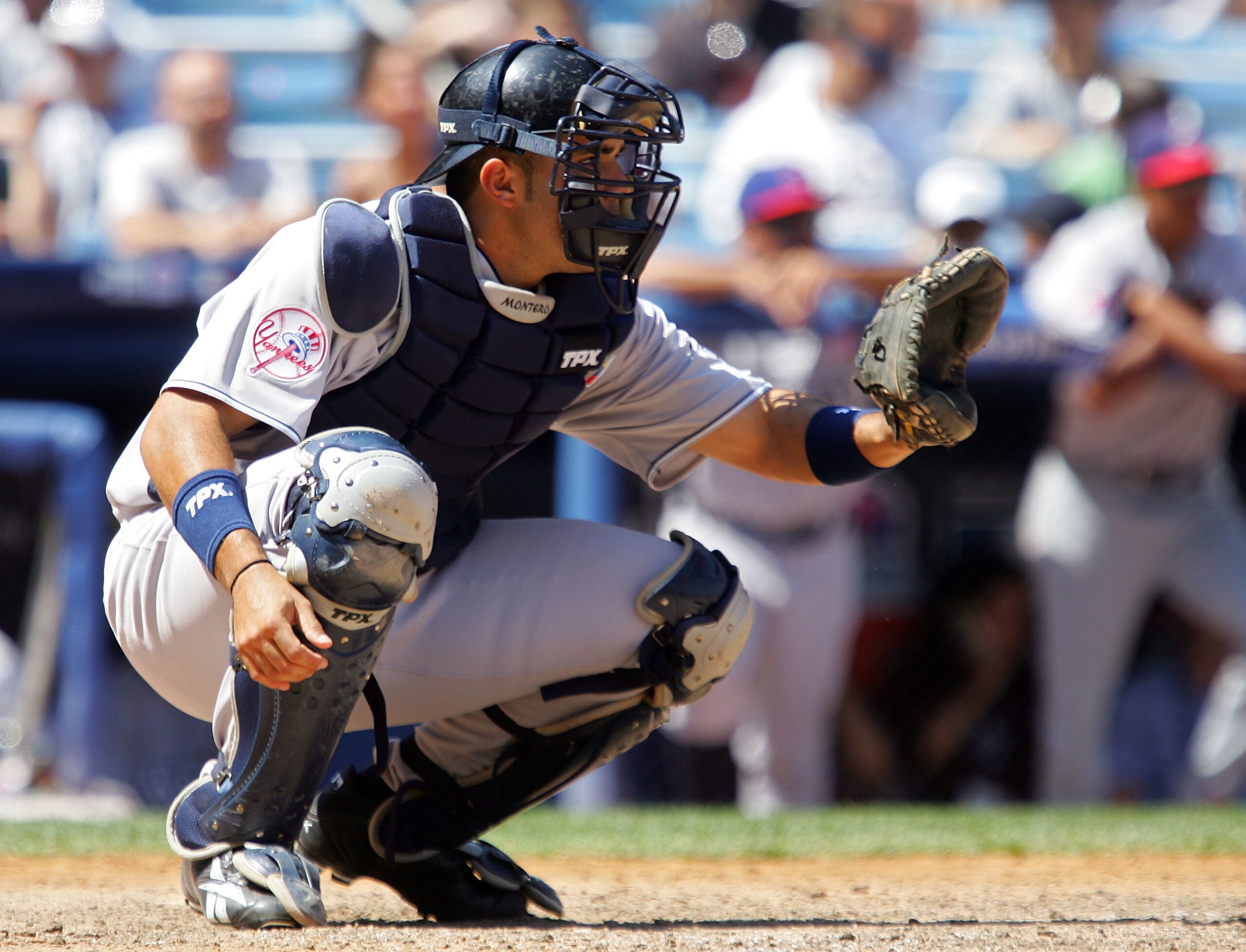 NEW YORK - JULY 13:  Jesus Montero of the New York Yankees and playing for World Futures Team catches against the United States Olympic Team during the 2008 XM All-Star Futures Game at Yankee Stadium on July 13, 2008 in the Bronx borough of New York City.