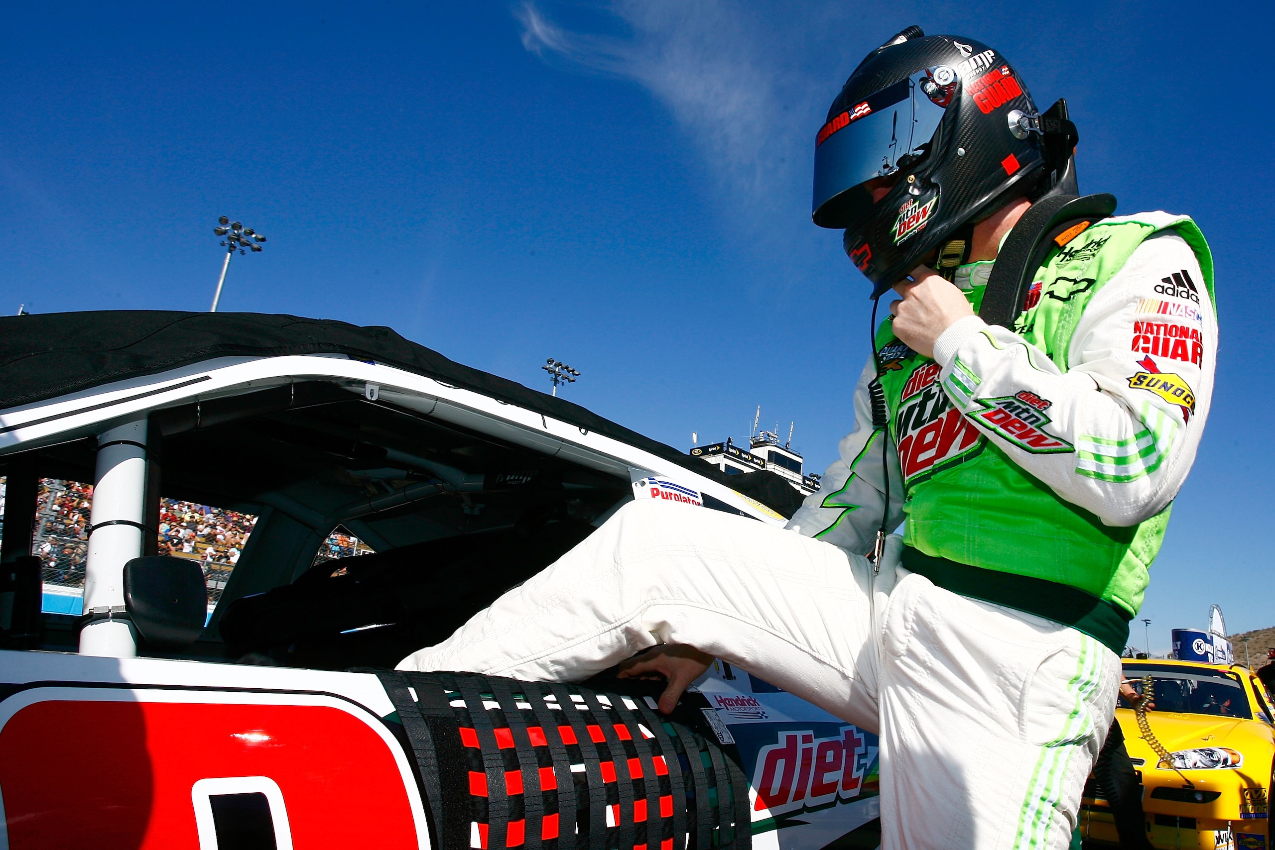 AVONDALE, AZ - NOVEMBER 14: Dale Earnhardt Jr., driver of the #88 Diet Mountain Dew Chevrolet, climbs in to his car prior to the NASCAR Sprint Cup Series Kobalt Tools 500 at Phoenix International Raceway on November 14, 2010 in Avondale, Arizona. (Photo AVONDALE, AZ - NOVEMBER 14: Dale Earnhardt Jr., driver of the #88 Diet Mountain Dew Chevrolet, climbs in to his car prior to the NASCAR Sprint Cup Series Kobalt Tools 500 at Phoenix International Raceway on November 14, 2010 in Avondale, Arizona. (Photo