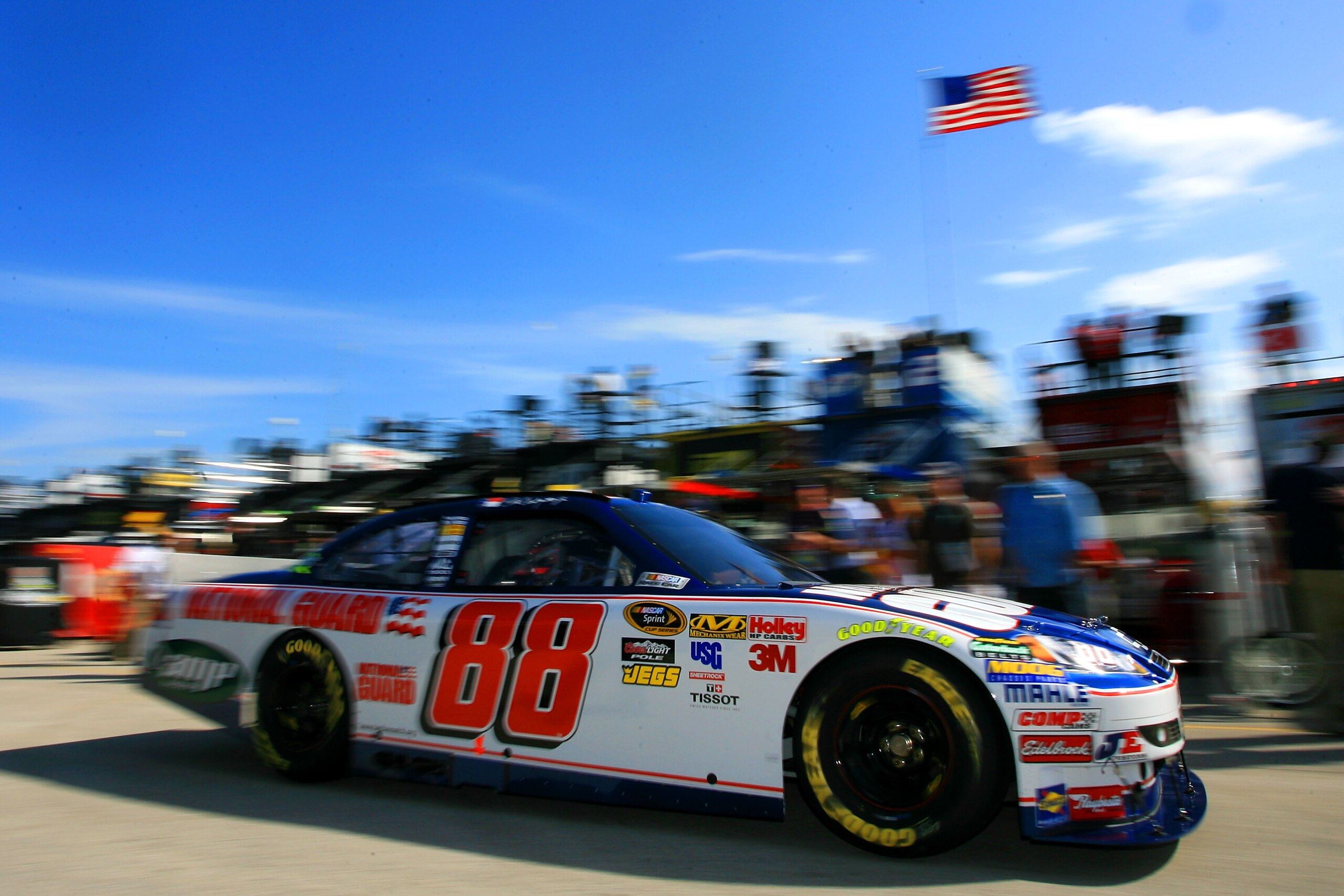 HOMESTEAD, FL - NOVEMBER 20: Dale Earnhardt Jr. drives the #88 National Guard/AMP Energy Chevrolet through the garage area during practice for the NASCAR Sprint Cup Series Ford 400 at Homestead-Miami Speedway on November 20, 2010 in Homestead, Florida. HOMESTEAD, FL - NOVEMBER 20: Dale Earnhardt Jr. drives the #88 National Guard/AMP Energy Chevrolet through the garage area during practice for the NASCAR Sprint Cup Series Ford 400 at Homestead-Miami Speedway on November 20, 2010 in Homestead, Florida.