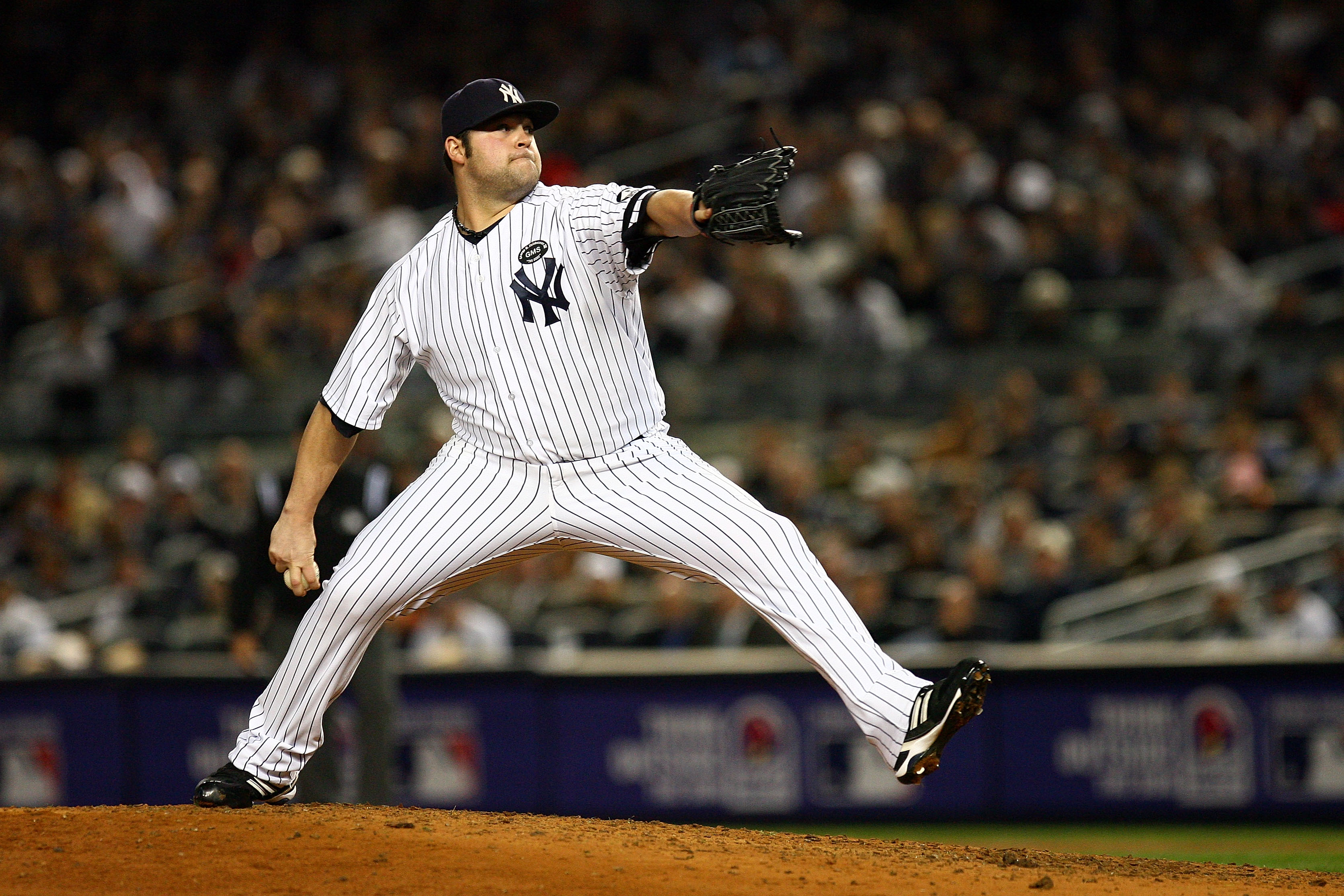 NEW YORK - OCTOBER 19: Joba Chamberlain #62 of the New York Yankees pitches against the Texas Rangers in Game Four of the ALCS during the 2010 MLB Playoffs at Yankee Stadium on October 19, 2010 in the Bronx borough of New York City. (Photo by Andrew Bur NEW YORK - OCTOBER 19: Joba Chamberlain #62 of the New York Yankees pitches against the Texas Rangers in Game Four of the ALCS during the 2010 MLB Playoffs at Yankee Stadium on October 19, 2010 in the Bronx borough of New York City. (Photo by Andrew Bur