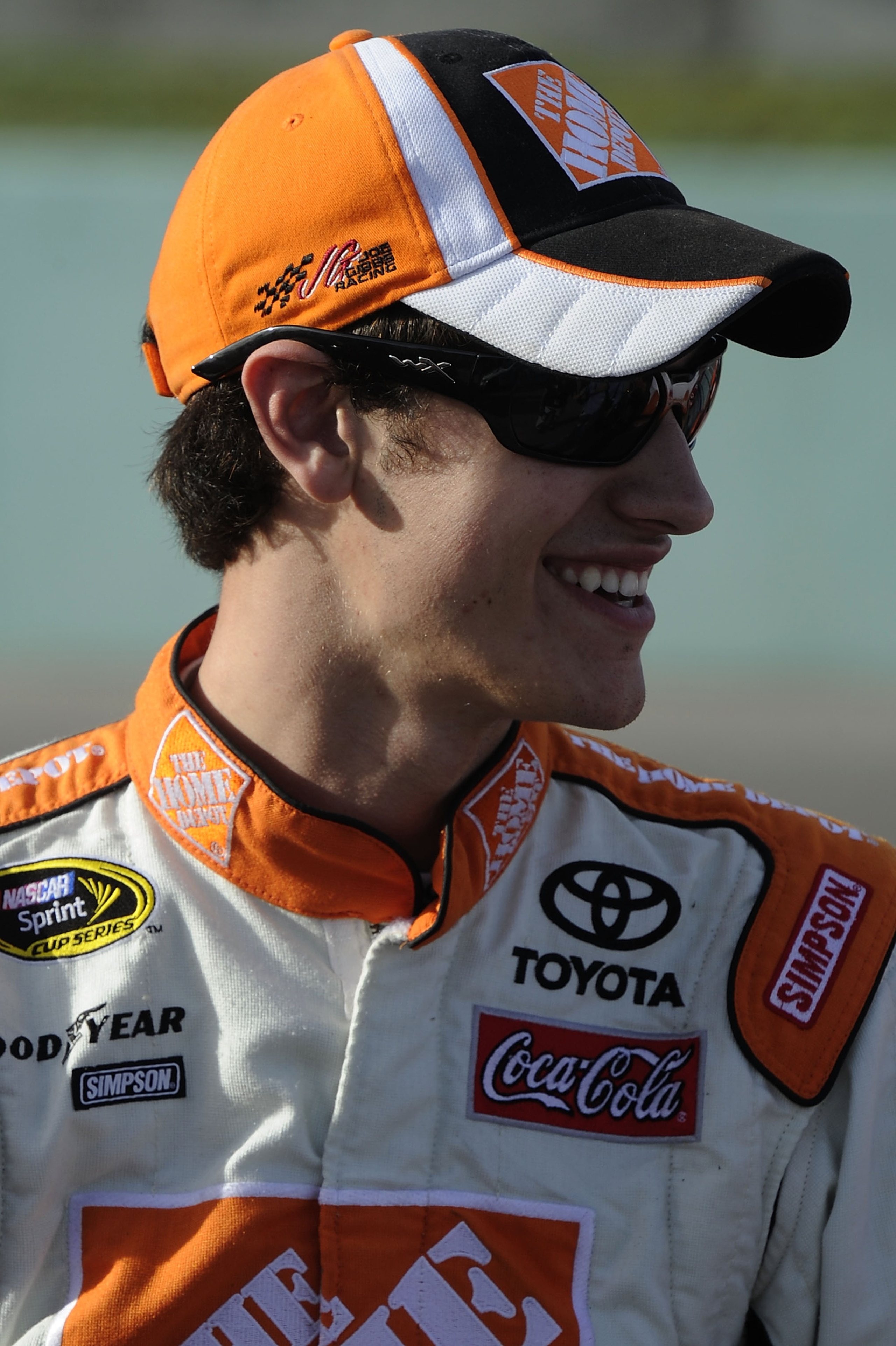 HOMESTEAD, FL - NOVEMBER 19: Joey Logano, driver of the #20 Home Depot Toyota, walks on the grid during qualifying for the NASCAR Sprint Cup Series Ford 400 at Homestead-Miami Speedway on November 19, 2010 in Homestead, Florida. (Photo by John Harrelson HOMESTEAD, FL - NOVEMBER 19: Joey Logano, driver of the #20 Home Depot Toyota, walks on the grid during qualifying for the NASCAR Sprint Cup Series Ford 400 at Homestead-Miami Speedway on November 19, 2010 in Homestead, Florida. (Photo by John Harrelson