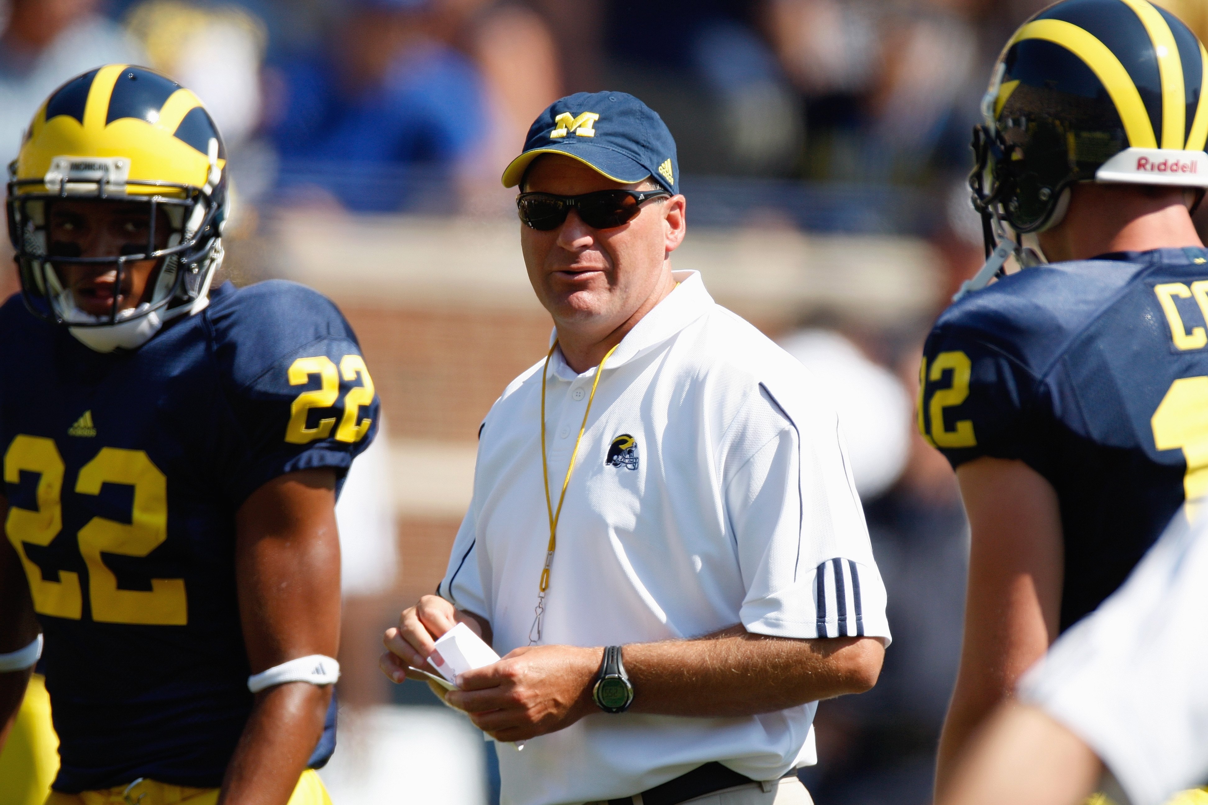 ANN ARBOR, MI - AUGUST 30:  Head coach Rich Rodriguez of the Michigan Wolverines watches the warmup before the game against the Utah Utes on August 30, 2008 at Michigan Stadium in Ann Arbor, Michigan. (Photo by: Gregory Shamus/Getty Images)
