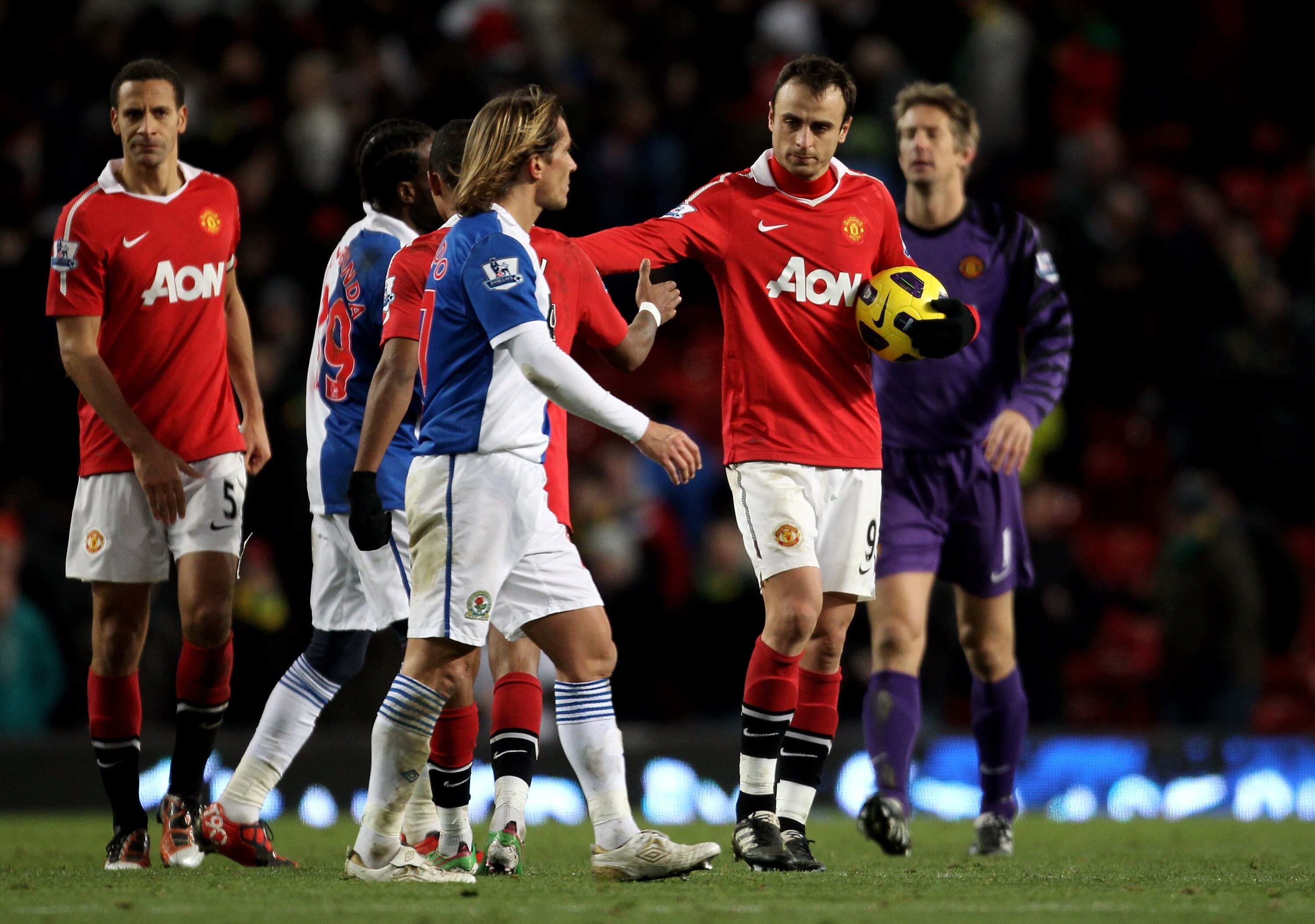 MANCHESTER, ENGLAND - NOVEMBER 27:  Dimitar Berbatov of Manchester United claims the match ball after scoring five goals, at the end of the Barclays Premier League match between Manchester United and Blackburn Rovers at Old Trafford on November 27, 2010 i