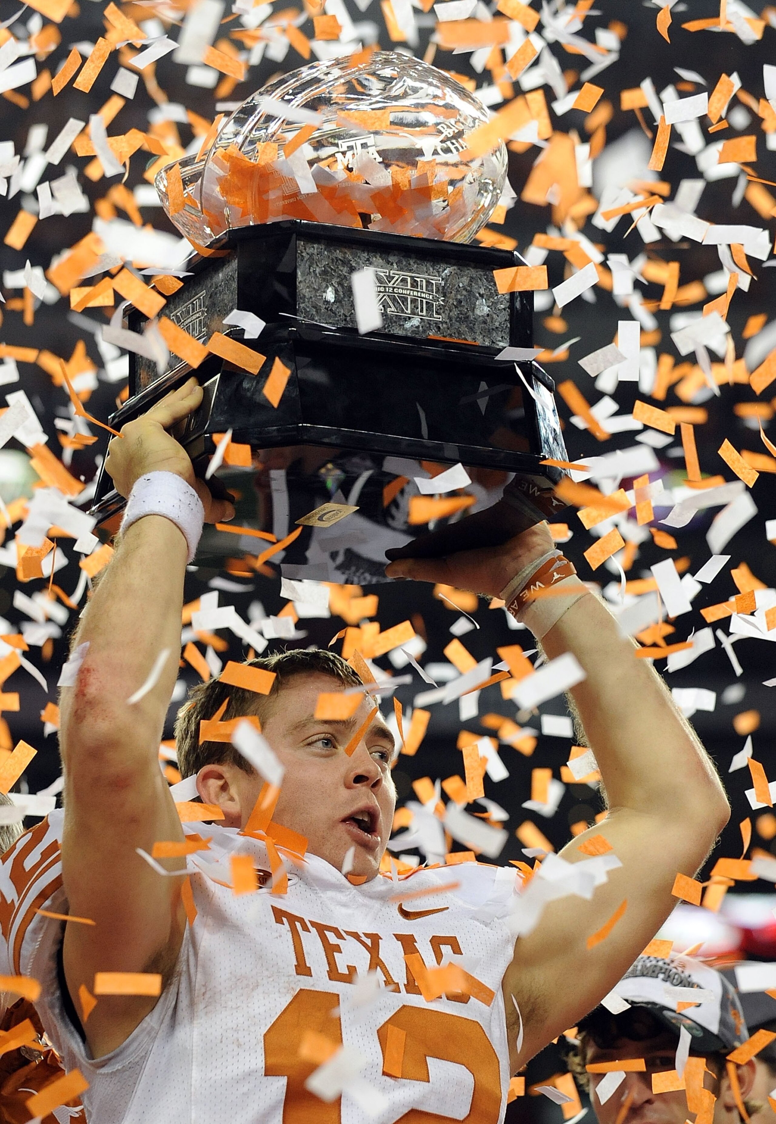 ARLINGTON, TX - DECEMBER 05: Quarterback Colt McCoy #12 of the Texas Longhorns lifts the Big 12 Championship trophy at Cowboys Stadium on December 5, 2009 in Arlington, Texas. (Photo by Ronald Martinez/Getty Images) ARLINGTON, TX - DECEMBER 05: Quarterback Colt McCoy #12 of the Texas Longhorns lifts the Big 12 Championship trophy at Cowboys Stadium on December 5, 2009 in Arlington, Texas. (Photo by Ronald Martinez/Getty Images)