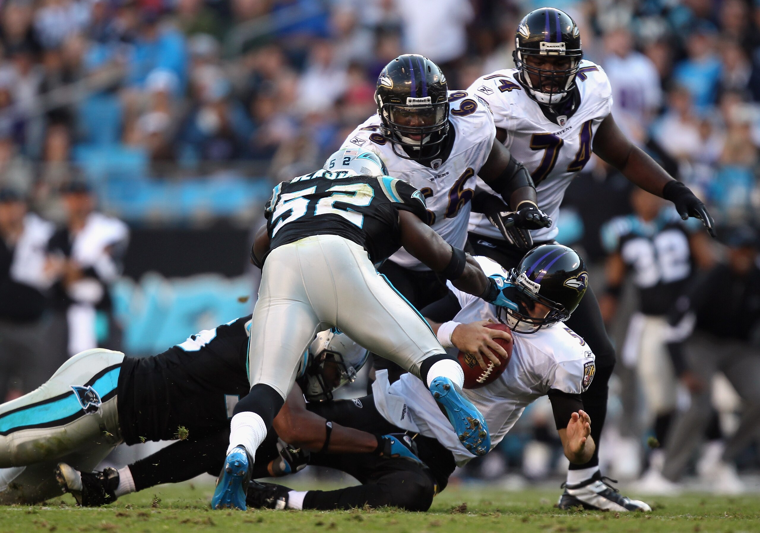 CHARLOTTE, NC - NOVEMBER 21:  Joe Flacco #5 of the Baltimore Ravens is tackled by Jon Beason #52 of the Carolina Panthers at Bank of America Stadium on November 21, 2010 in Charlotte, North Carolina.  (Photo by Streeter Lecka/Getty Images)