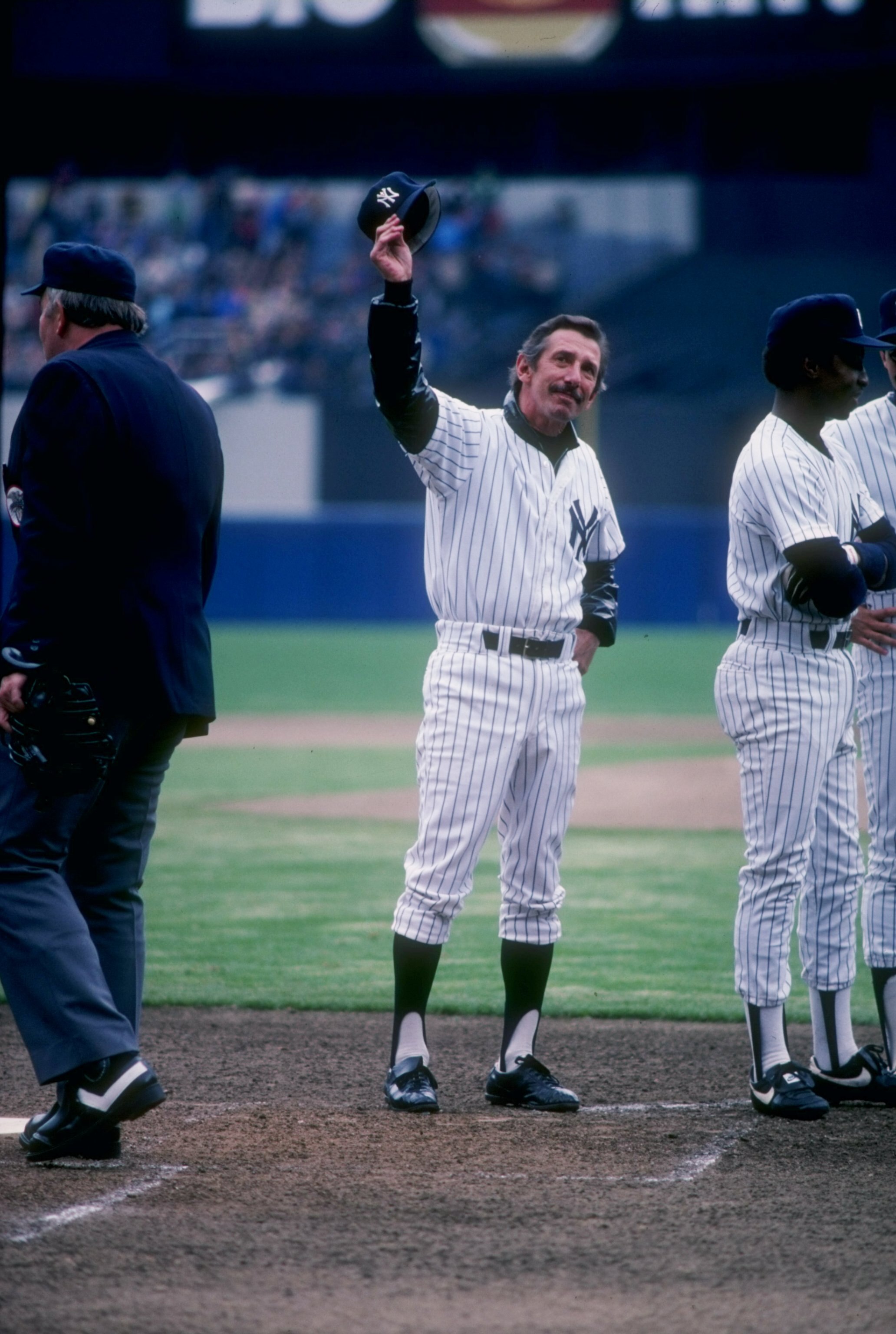 Manager Billy Martin of the New York Yankees waves to the crowd at Yankee Stadium in the Bronx, New York.
