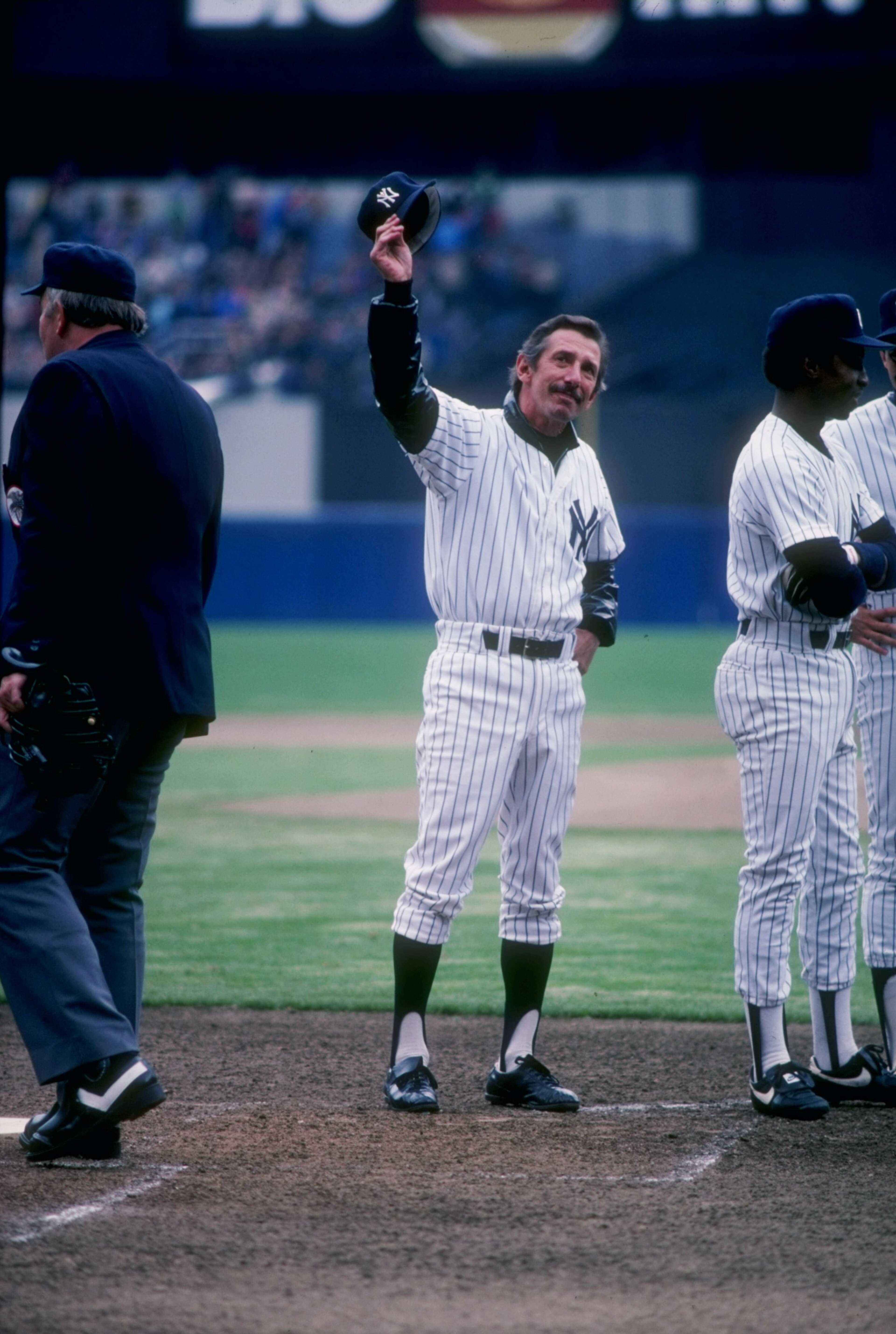 Manager Billy Martin of the New York Yankees waves to the crowd at Yankee Stadium in the Bronx, New York.
