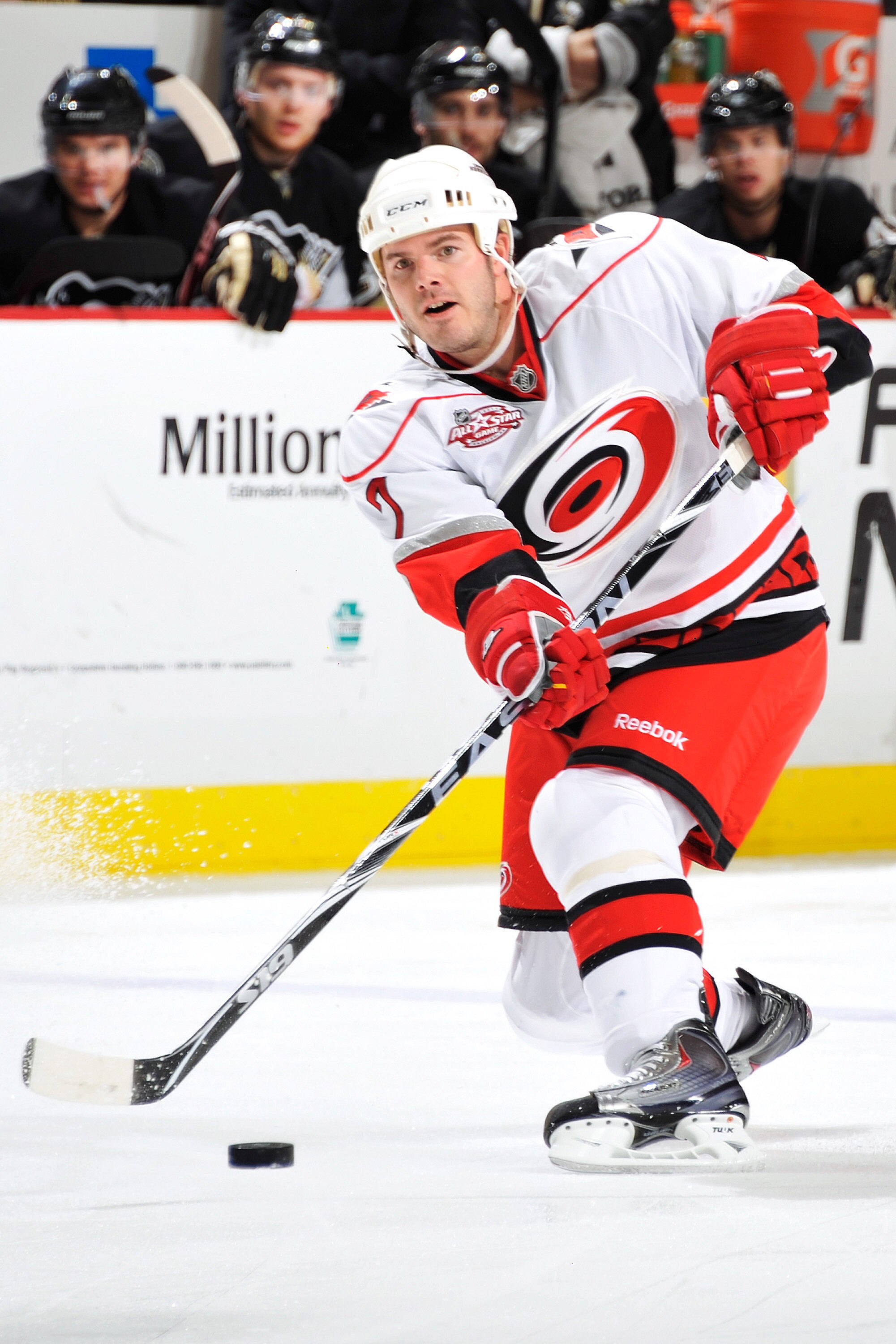 PITTSBURGH - NOVEMBER 19:  Ian White #7 of the Carolina Hurricanes skates with the puck against the Pittsburgh Penguins on November 19, 2010 at Consol Energy Center in Pittsburgh, Pennsylvania. White made his debut in a Carolina uniform after being traded