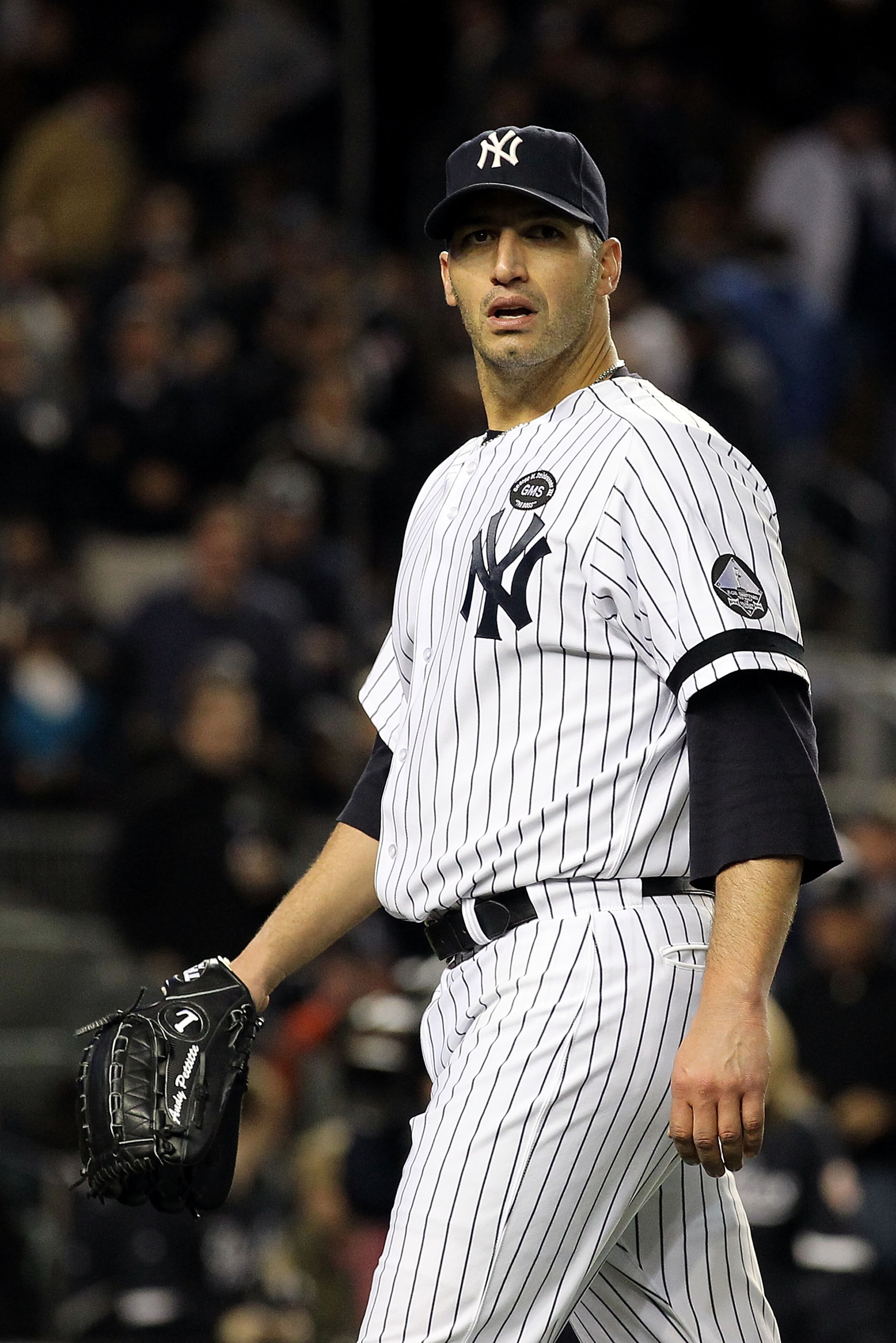 NEW YORK - OCTOBER 18: Andy Pettitte #46 of the New York Yankees walks back to the dugout at the end of the top of the seventh inning against the Texas Rangers in Game Three of the ALCS during the 2010 MLB Playoffs at Yankee Stadium on October 18, 2010 i NEW YORK - OCTOBER 18: Andy Pettitte #46 of the New York Yankees walks back to the dugout at the end of the top of the seventh inning against the Texas Rangers in Game Three of the ALCS during the 2010 MLB Playoffs at Yankee Stadium on October 18, 2010 i