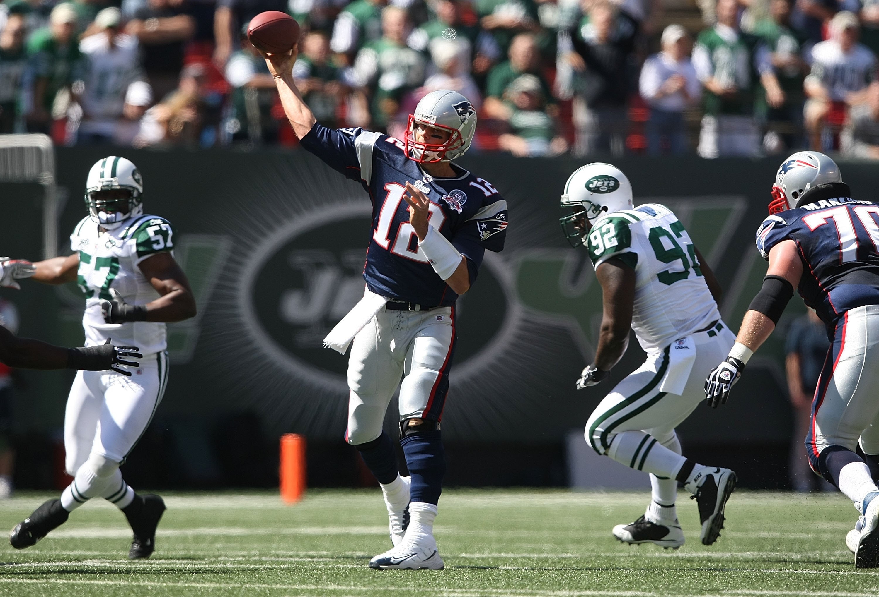 EAST RUTHERFORD, NJ - SEPTEMBER 20:  Tom Brady #12 of the New England Patriots passes against the New York Jets at Giants Stadium on September 20, 2009 in East Rutherford, New Jersey.  (Photo by Nick Laham/Getty Images)