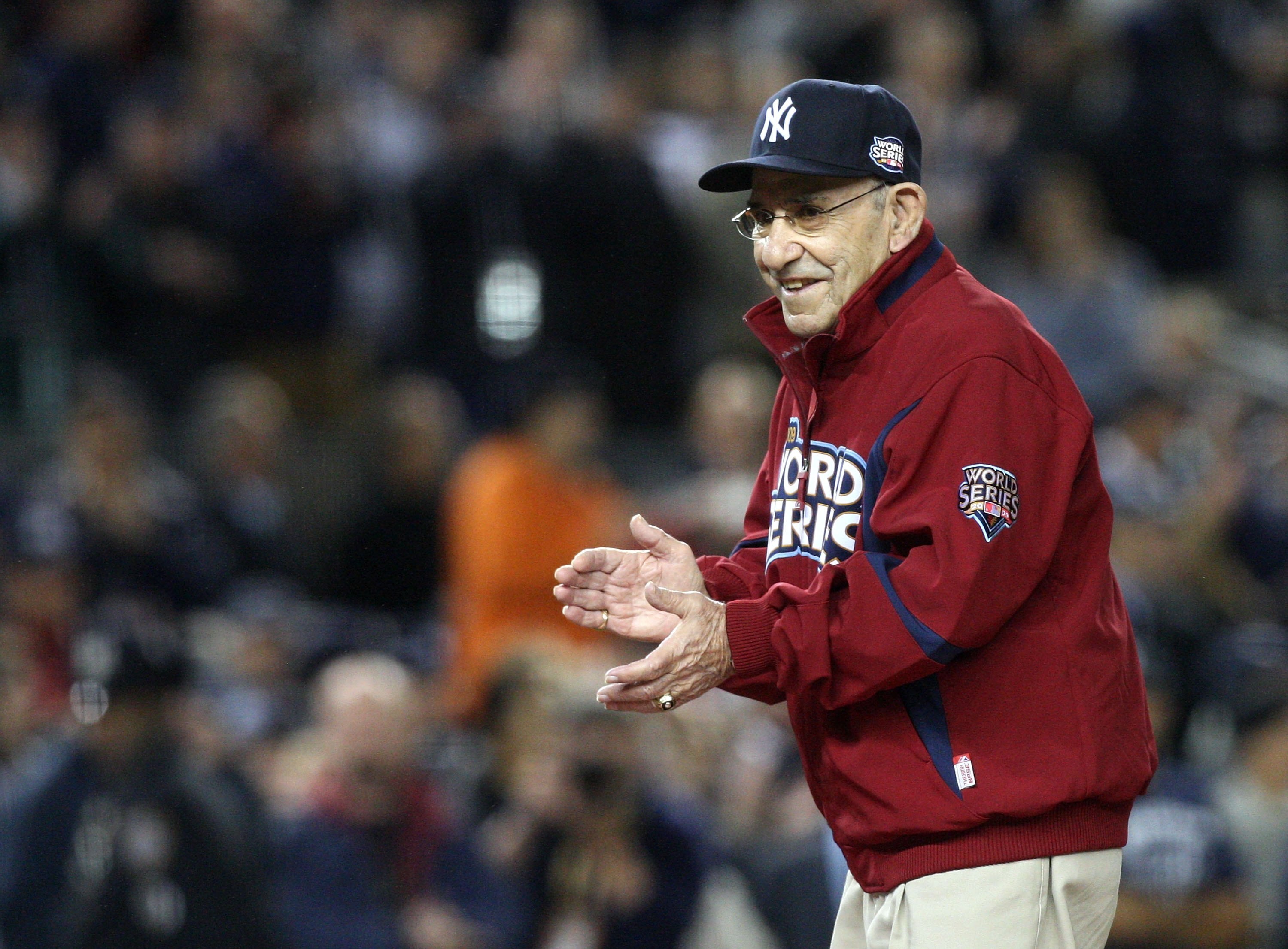 NEW YORK - OCTOBER 28:  New York Yankees legend and Baseball Hall of Famer Yogi Berra stands on the field for pregame festivities prior to Game One of the 2009 MLB World Series between the New York Yankees and the Philadelphia Phillies at Yankee Stadium o