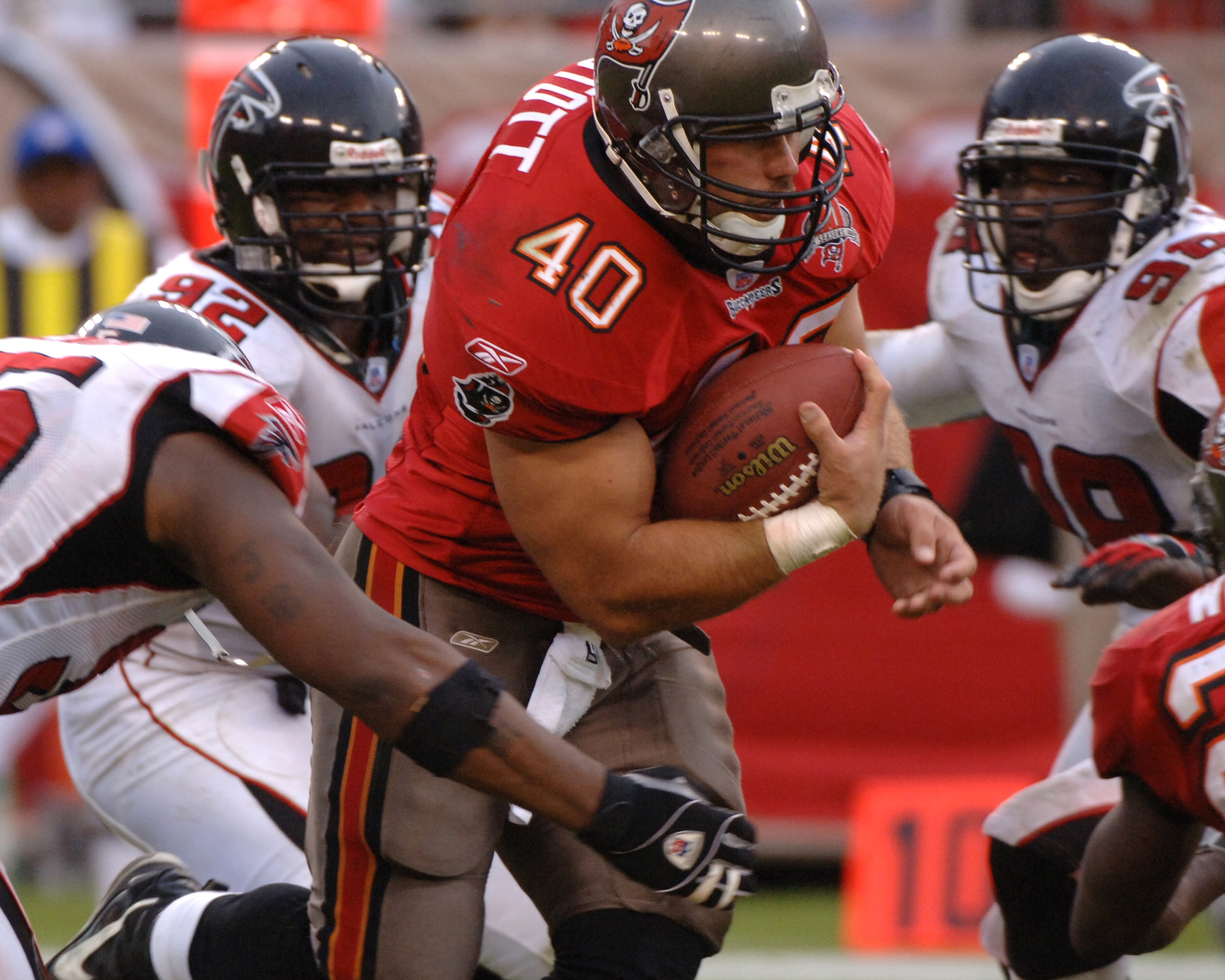 Tampa Bay Buccaneers fullback Mike Alstott rushes for a gain  against the Atlanta Falcons  December 24, 2005 in Tampa.  The Bucs defeated the Falcons 27 - 24.  (Photo by Al Messerschmidt/Getty Images)