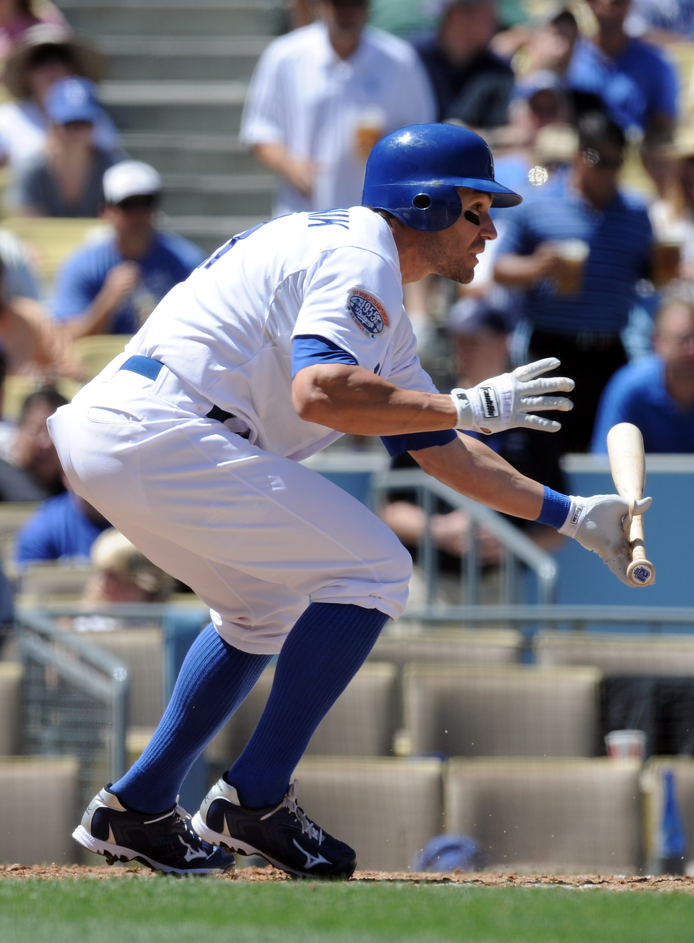 LOS ANGELES, CA - SEPTEMBER 01:  Scott Podsednik #21 of the Los Angeles Dodgers attempts a bunt against the Philadelphia Phillies at Dodger Stadium on September 1, 2010 in Los Angeles, California.  (Photo by Harry How/Getty Images)