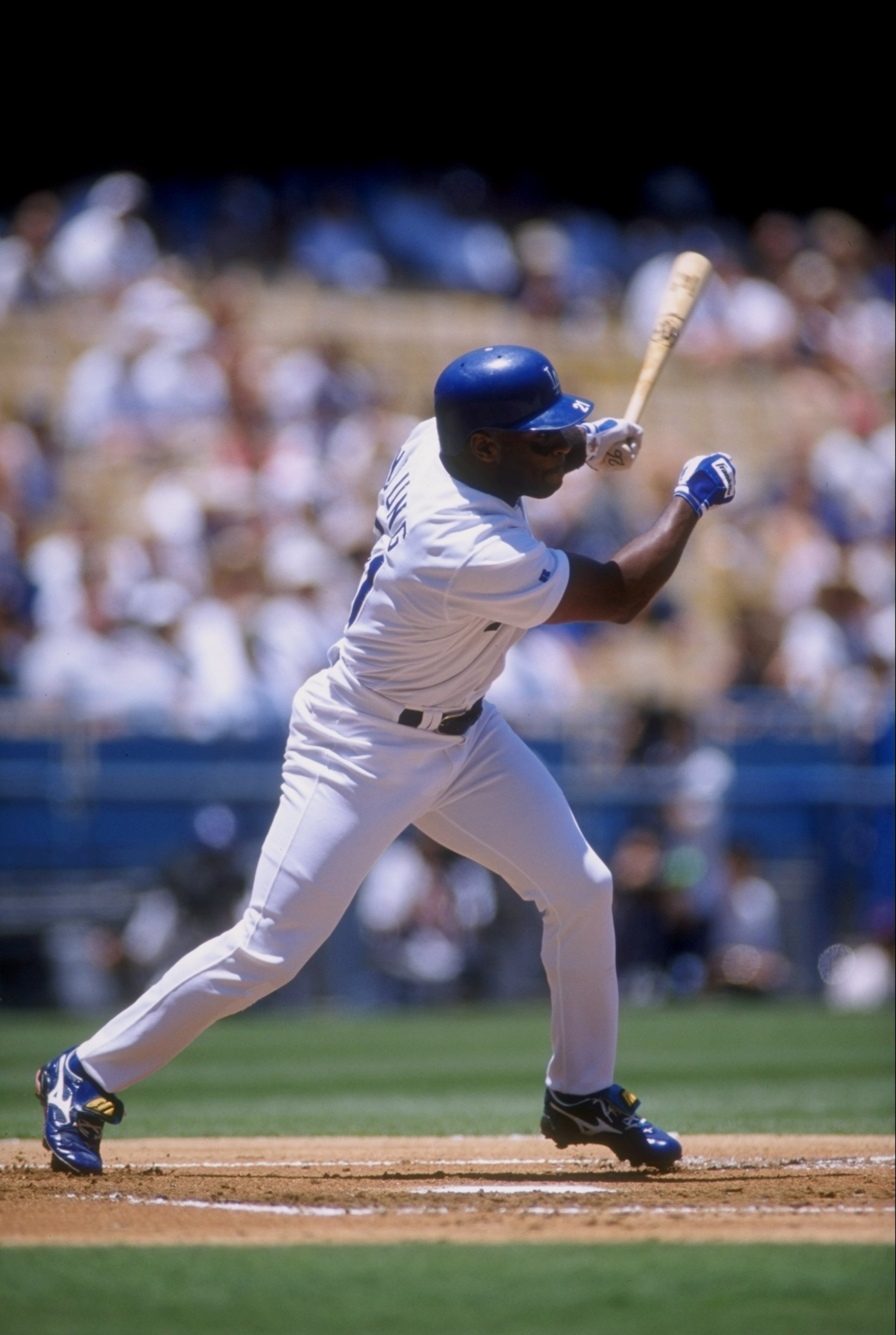 9 Jul 1998: Infielder Eric Young #21 of the Los Angeles Dodgers in action during a game against the San Diego Padres at Dodger Stadium in Los Angeles, California. The Dodgers won the game, 12-3. 9 Jul 1998: Infielder Eric Young #21 of the Los Angeles Dodgers in action during a game against the San Diego Padres at Dodger Stadium in Los Angeles, California. The Dodgers won the game, 12-3.