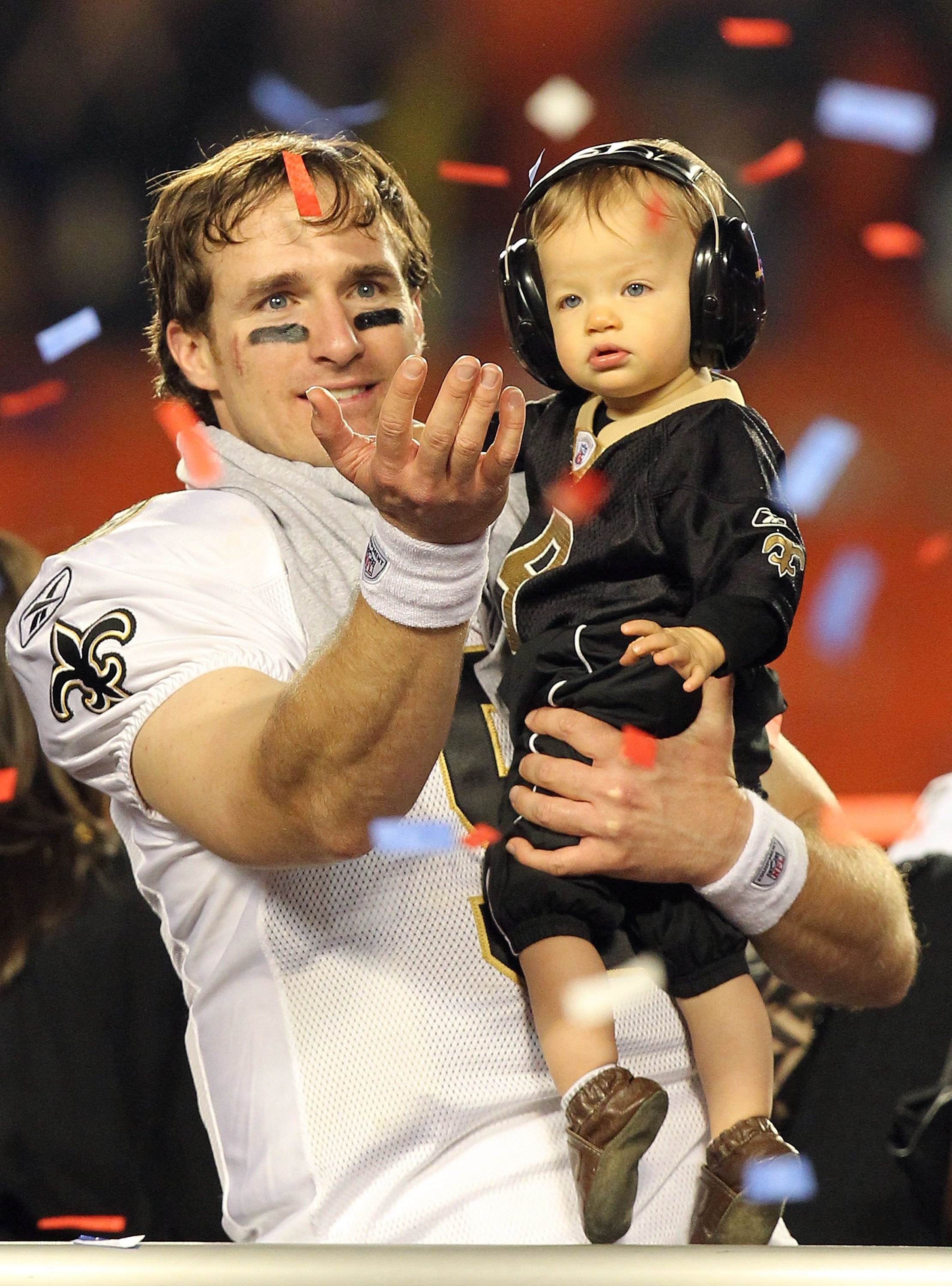 MIAMI GARDENS, FL - FEBRUARY 07:  Drew Brees #9 of the New Orleans Saints celebrates with his son Baylen Brees after defeating the Indianapolis Colts during Super Bowl XLIV on February 7, 2010 at Sun Life Stadium in Miami Gardens, Florida.  (Photo by Rona