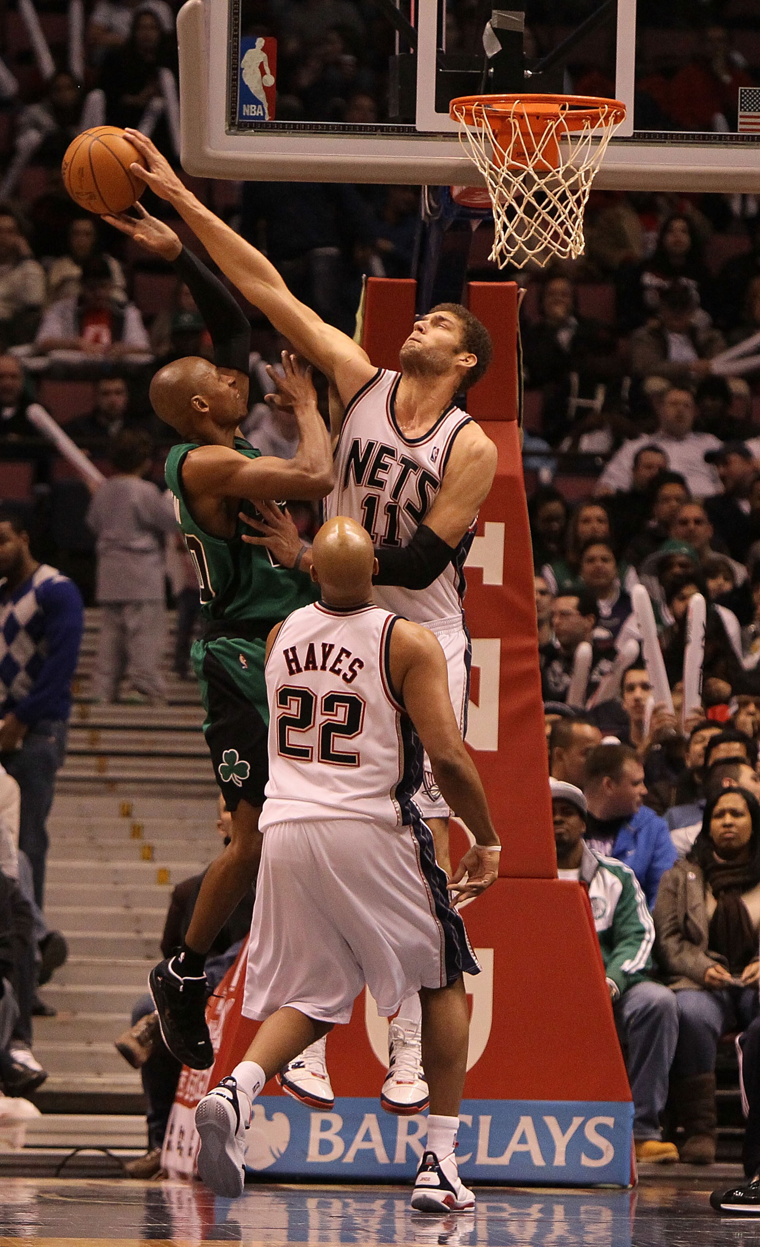 EAST RUTHERFORD, NJ - JANUARY 13:  Brook Lopez #11 of the New Jersey Nets blocks a shot against Ray Allen #20 of the Boston Celtics during their game on January 13th, 2010 at The Izod Center in East Rutherford, New Jersey. NOTE TO USER: User expressly ack