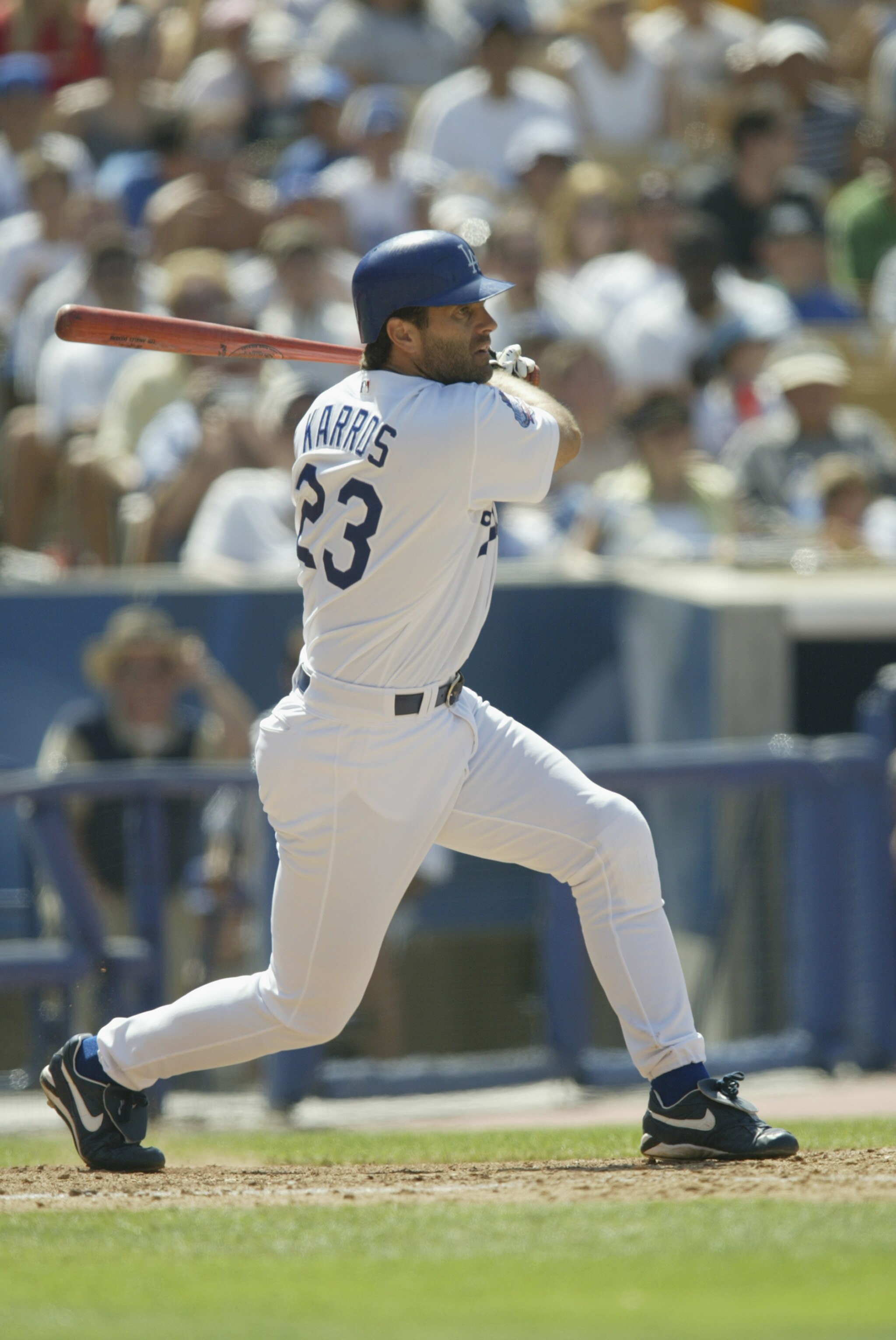 LOS ANGELES - JULY 20:  First Baseman Eric Karros #23 of the Los Angeles Dodgers fouls off a pitch from Felix Rodriguez of the San Francisco Giants in the seventh inning of the MLB game on July 20, 2002 at Dodger Stadium in Los Angeles, California. The Do