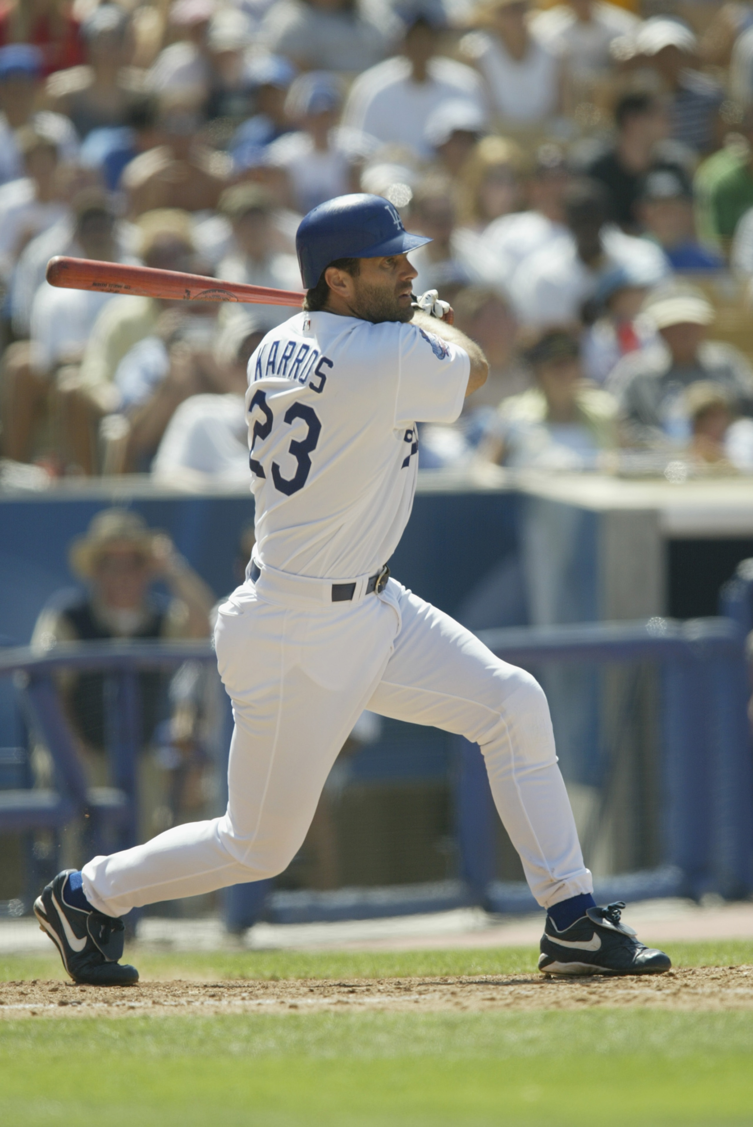 LOS ANGELES - JULY 20: First Baseman Eric Karros #23 of the Los Angeles Dodgers fouls off a pitch from Felix Rodriguez of the San Francisco Giants in the seventh inning of the MLB game on July 20, 2002 at Dodger Stadium in Los Angeles, California. The Do LOS ANGELES - JULY 20: First Baseman Eric Karros #23 of the Los Angeles Dodgers fouls off a pitch from Felix Rodriguez of the San Francisco Giants in the seventh inning of the MLB game on July 20, 2002 at Dodger Stadium in Los Angeles, California. The Do