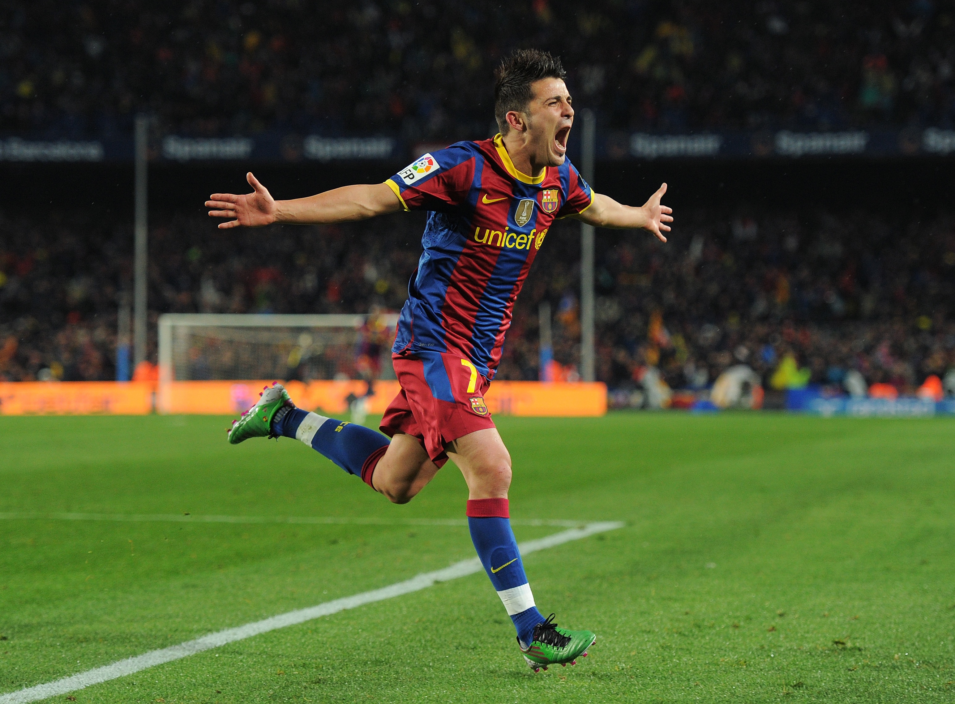 BARCELONA, SPAIN - NOVEMBER 29:  David Villa of Barcelona celebrates scoring his sides fourth goal during the la liga match between Barcelona and Real Madrid at the Camp Nou stadium on November 29, 2010 in Barcelona, Spain.  (Photo by Jasper Juinen/Getty