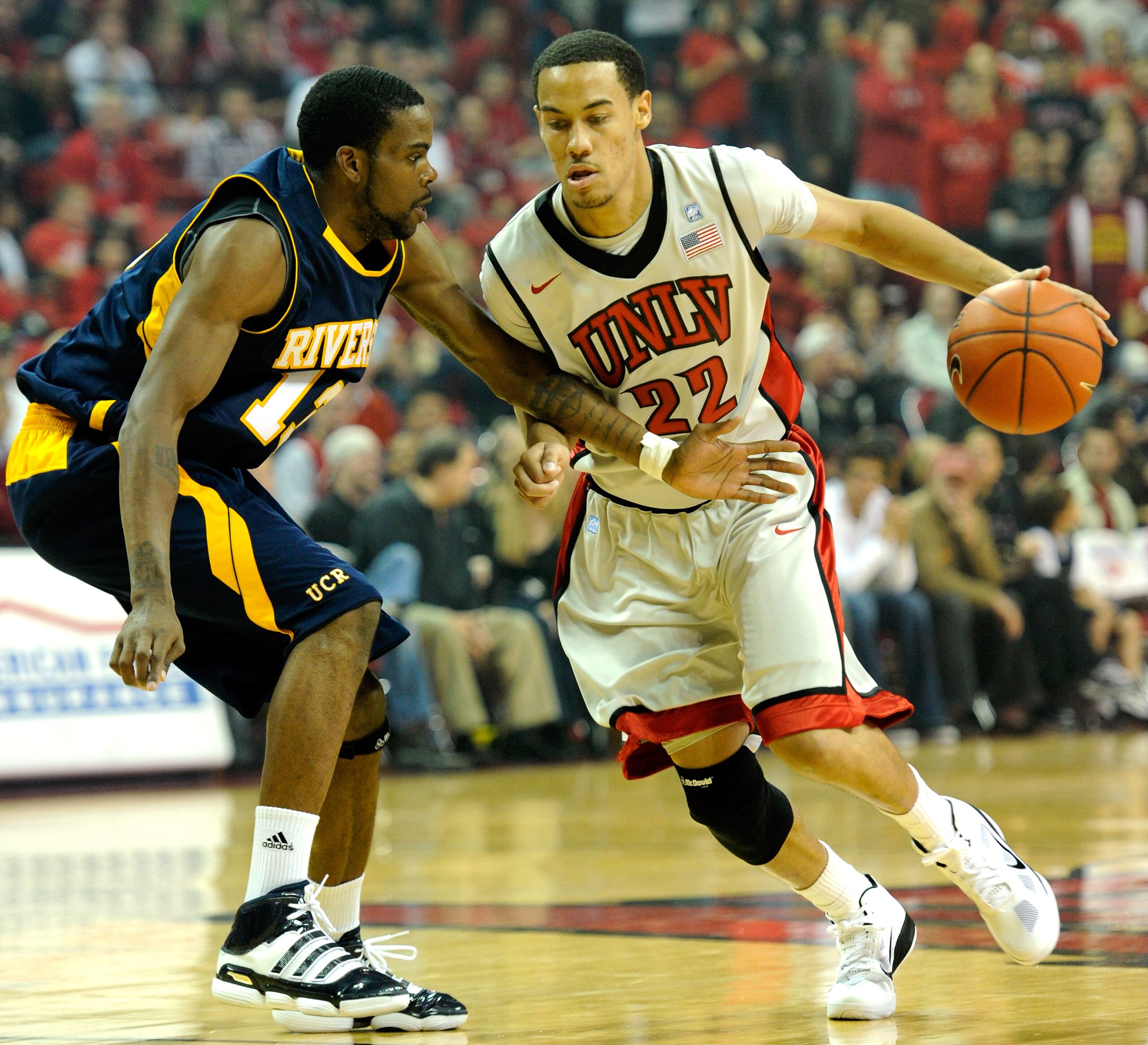 LAS VEGAS - NOVEMBER 12:  Chace Stanback #22 of the UNLV Rebels drives against Elliott Berry #13 of the UC Riverside Highlanders during their game at the Thomas & Mack Center November 12, 2010 in Las Vegas, Nevada. UNLV won 85-41.  (Photo by Ethan Miller/