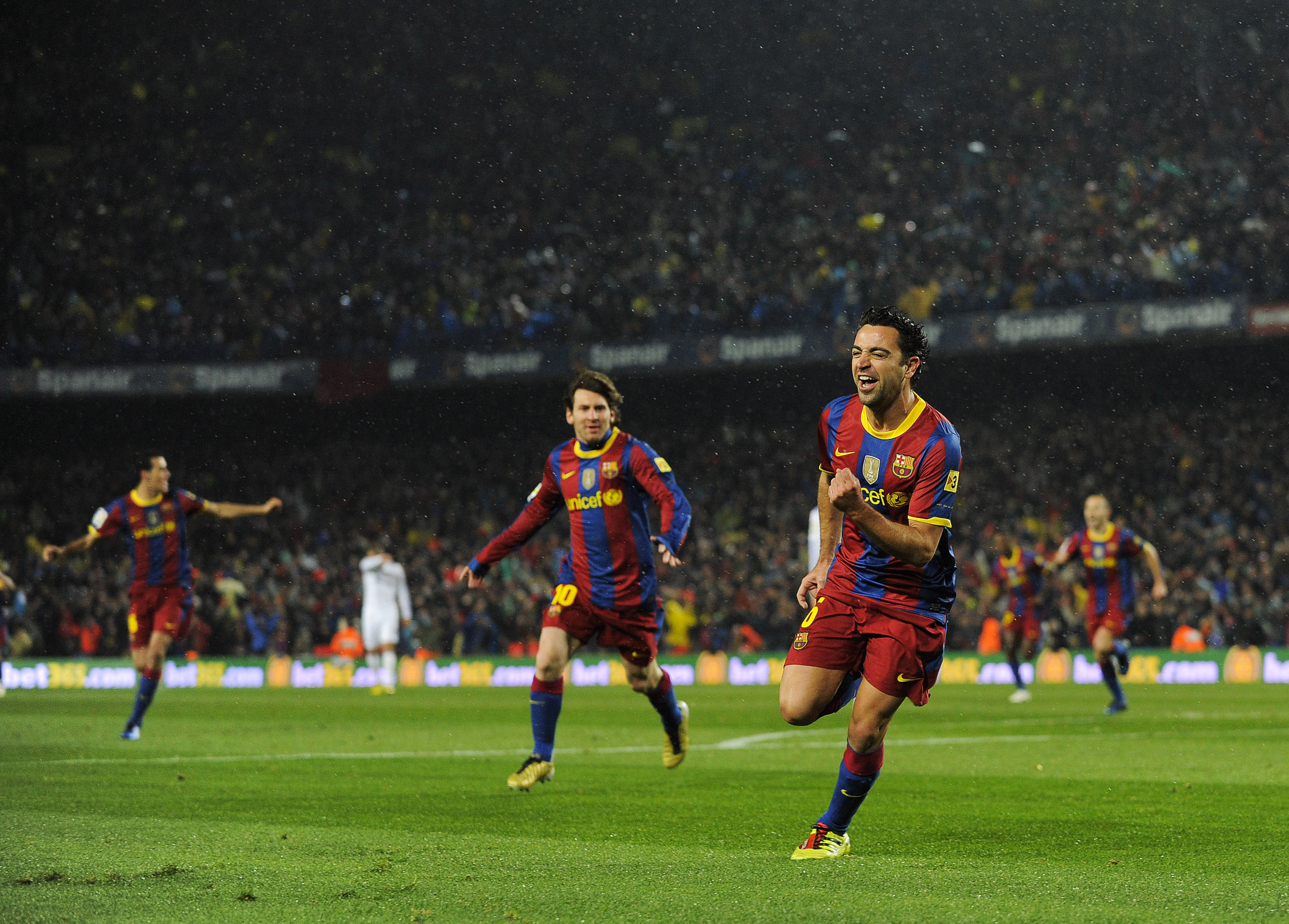 BARCELONA, SPAIN - NOVEMBER 29:  Xavi Hernandez of Barcelona celebrates after scoring the first goal during the La Liga match between Barcelona and Real Madrid at the Camp Nou Stadium on November 29, 2010 in Barcelona, Spain.  Barcelona won the match 5-0.