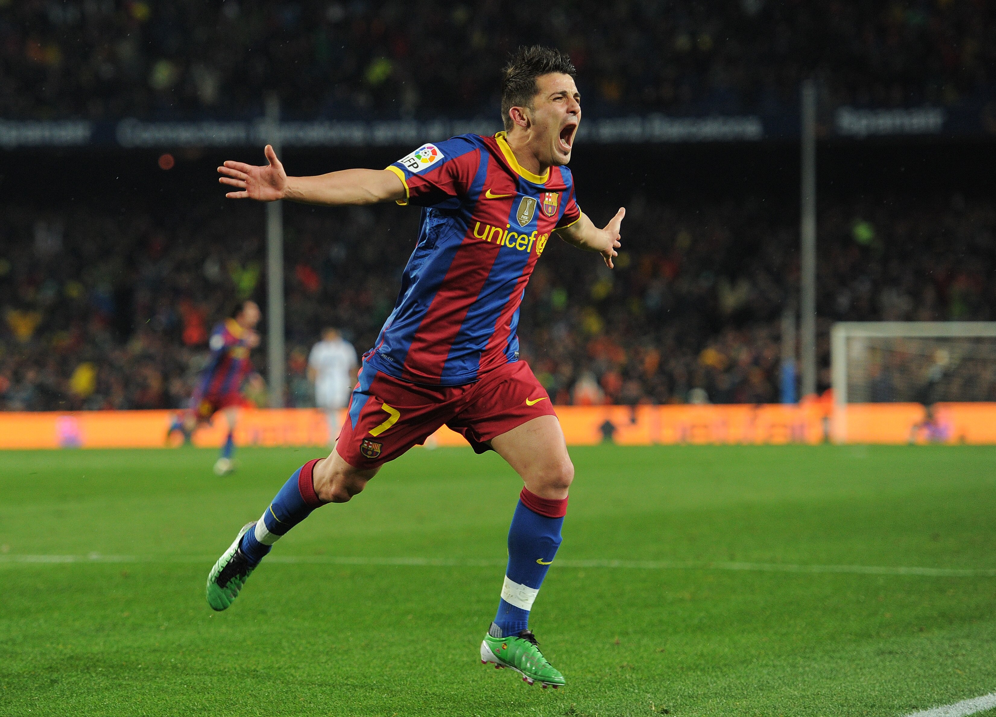 BARCELONA, SPAIN - NOVEMBER 29:  David Villa of Barcelona celebrates scoring his sides fourth goal during the la liga match between Barcelona and Real Madrid at the Camp Nou stadium on November 29, 2010 in Barcelona, Spain.  (Photo by Jasper Juinen/Getty
