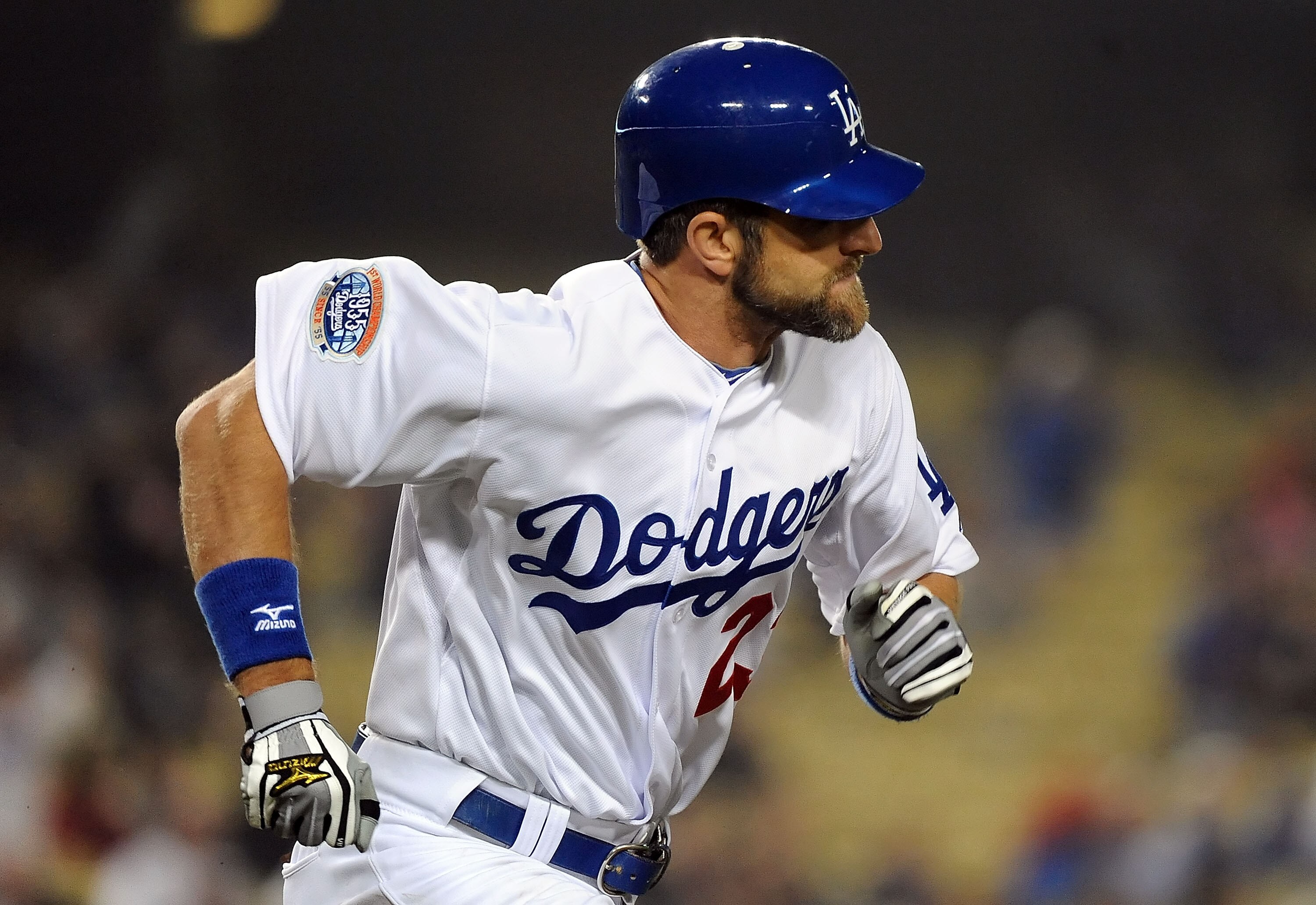 LOS ANGELES, CA - SEPTEMBER 17:  Casey Blake #23 of the Los Angeles Dodgers runs to first base afeter hitting a RBI single in the ninth inning against the Colorado Rockies at Dodger Stadium on September 17, 2010 in Los Angeles, California.  (Photo by Lisa