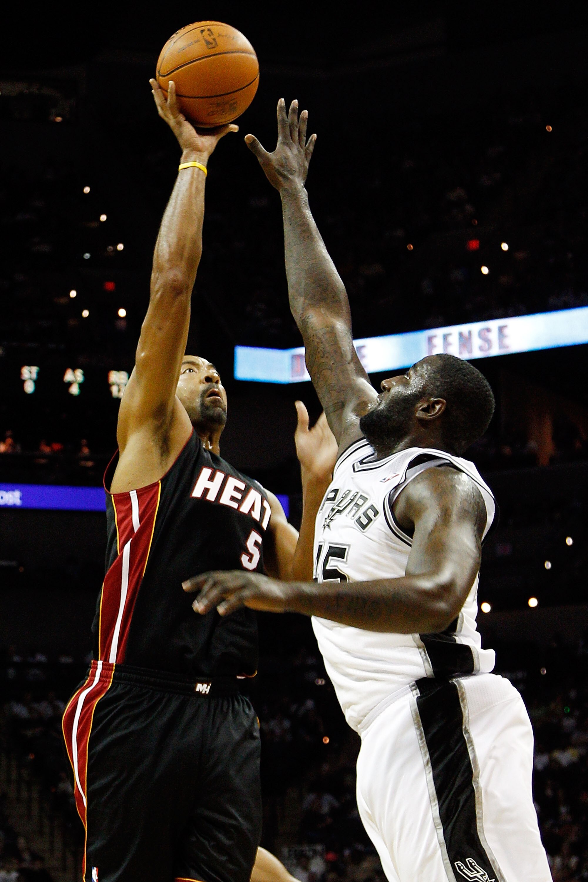 SAN ANTONIO - OCTOBER 09:  Juwan Howard #5 of the Miami Heat makes a shot over DeJuan Blair #45 of the San Antonio Spurs at the AT&T Center on October 9, 2010 in San Antonio, Texas.  NOTE TO USER: User expressly acknowledges and agrees that, by downloadin