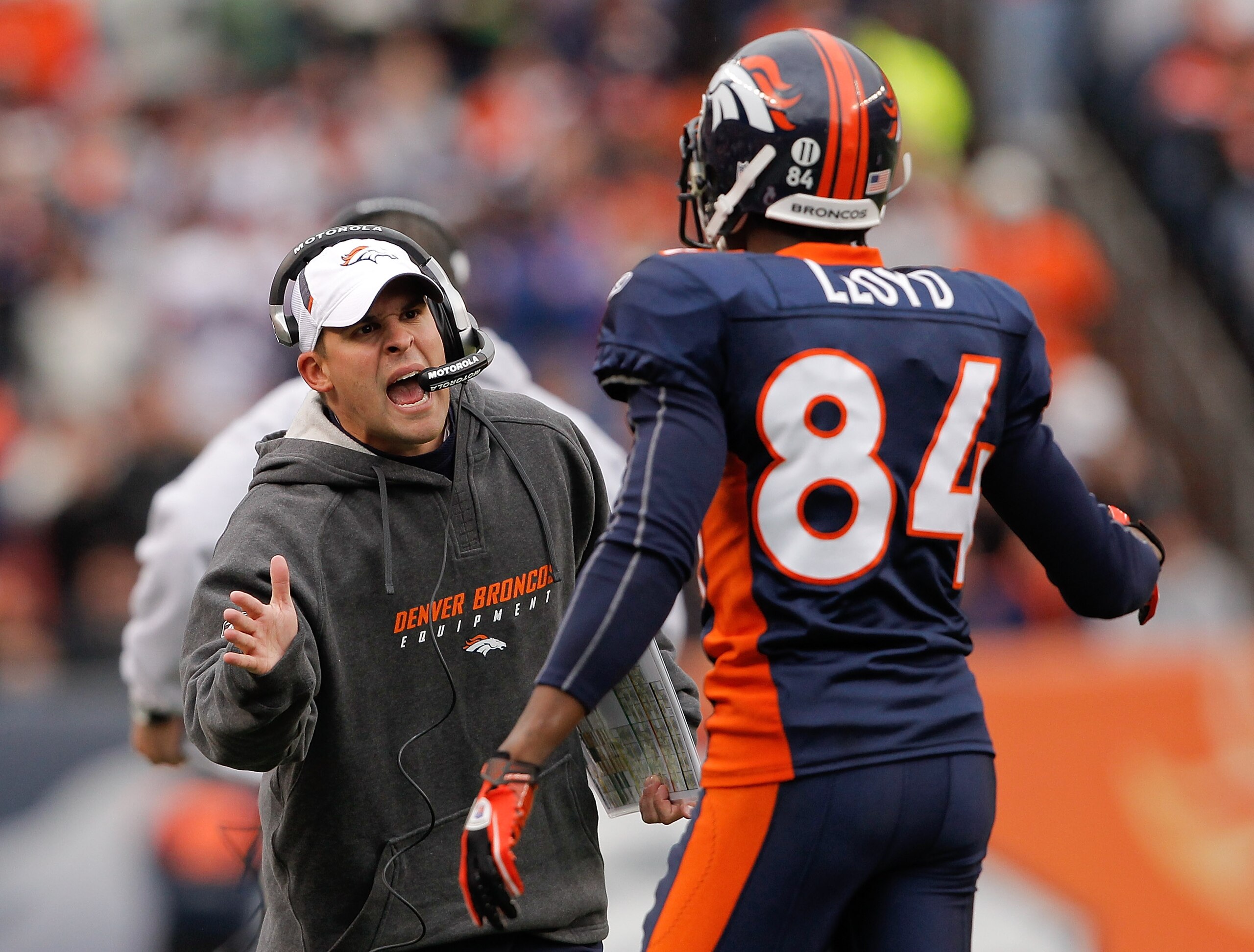 DENVER - NOVEMBER 28:  Head coach Josh McDaniels of the Denver Broncos celebrates a touchdown by Knowshon Moreno with wide receiver Brandon Lloyd #84 against the St. Louis Rams at INVESCO Field at Mile High on November 28, 2010 in Denver, Colorado. The Ra