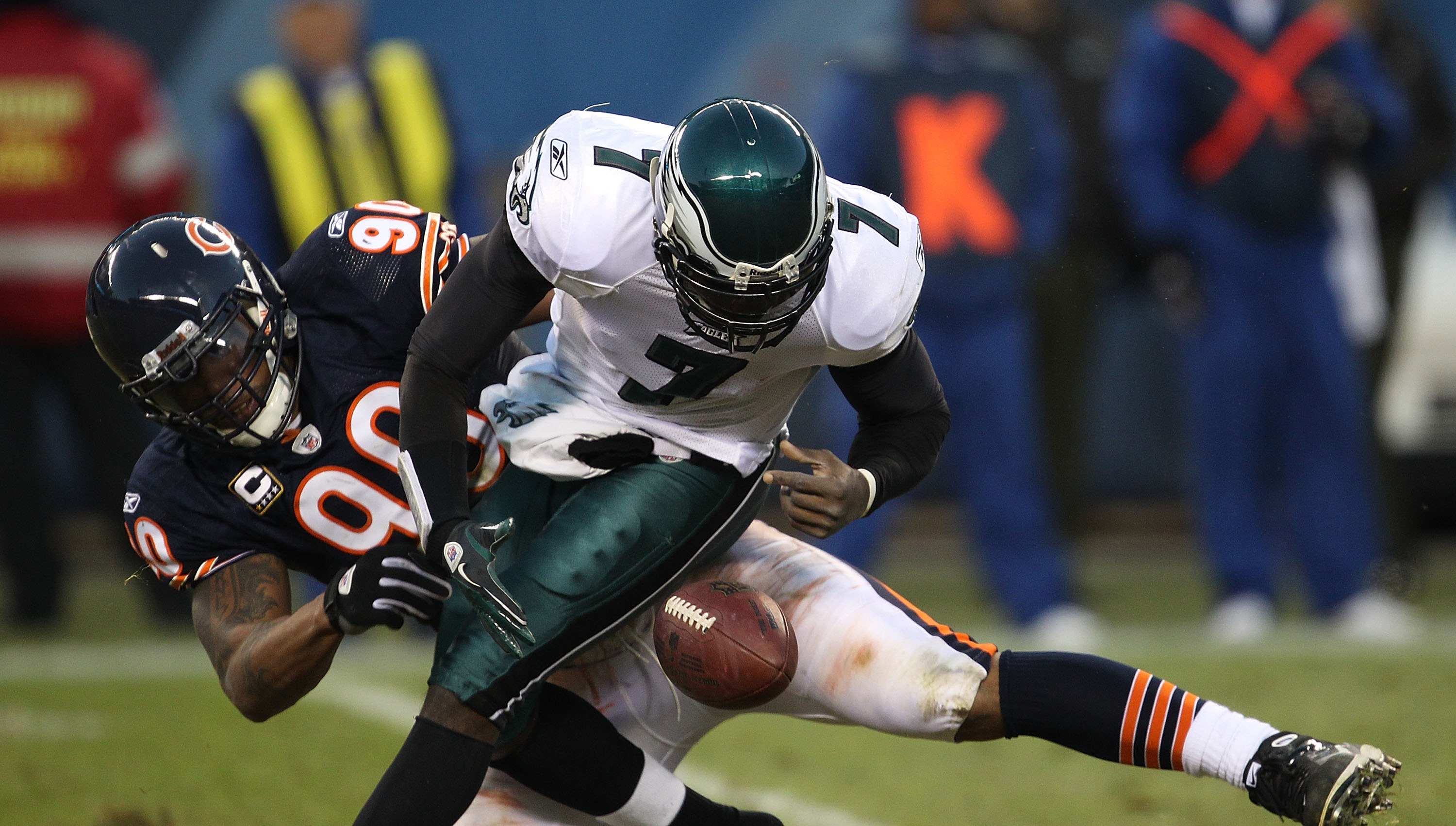 CHICAGO - NOVEMBER 28: Michael Vick #7 of the Philadelphia Eagles fumbles the ball as he is sacked by Julius Peppers #90 of the Chicago Bears at Soldier Field on November 28, 2010 in Chicago, Illinois. (Photo by Jonathan Daniel/Getty Images)
