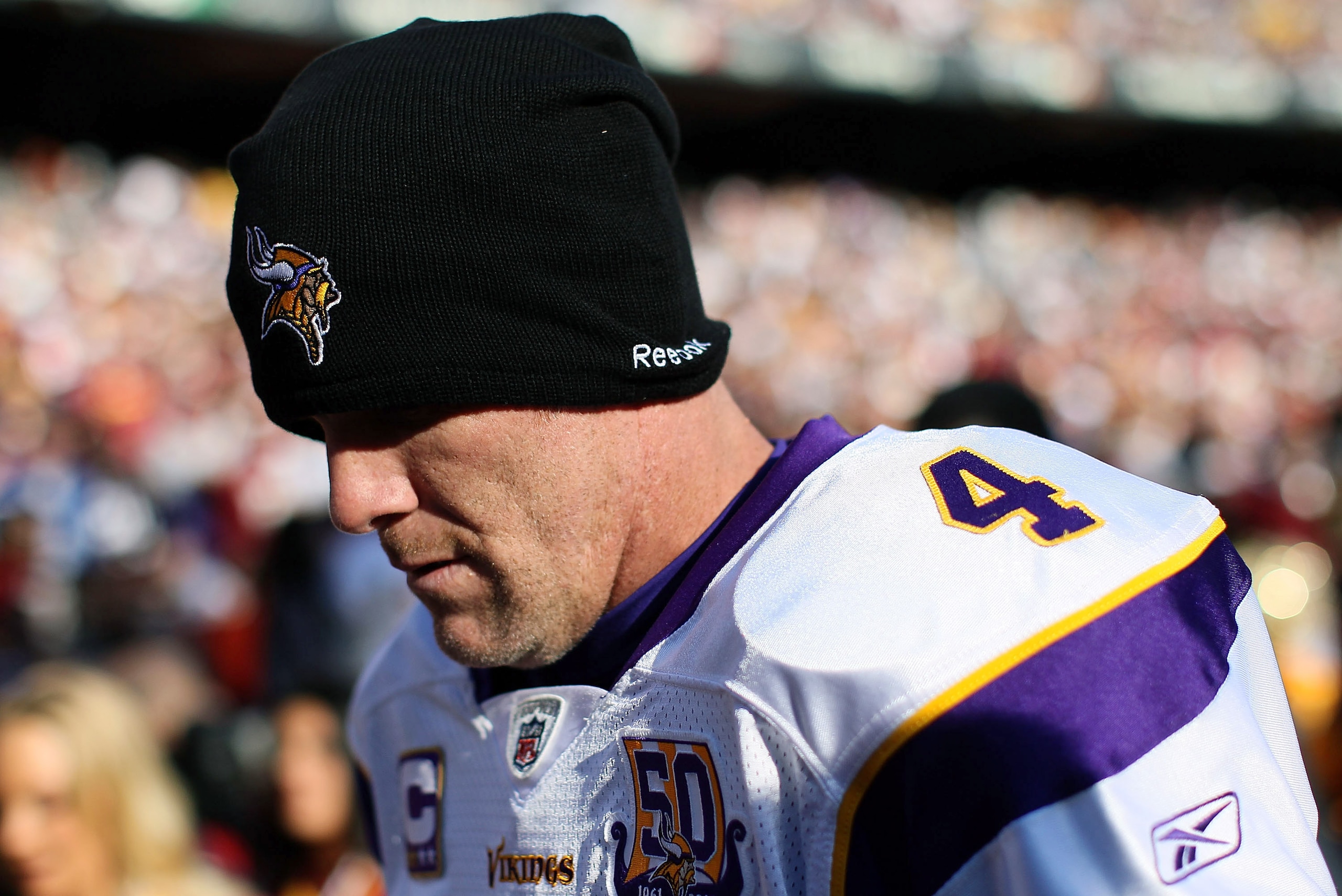 LANDOVER, MD - NOVEMBER 28:  Brett Favre #4 of the Minnesota Vikings walks off the field at the end of the first half against the Washington Redskins at FedExField November 28, 2010 in Landover, Maryland. The Vikings won the game 17-13.  (Photo by Win McN