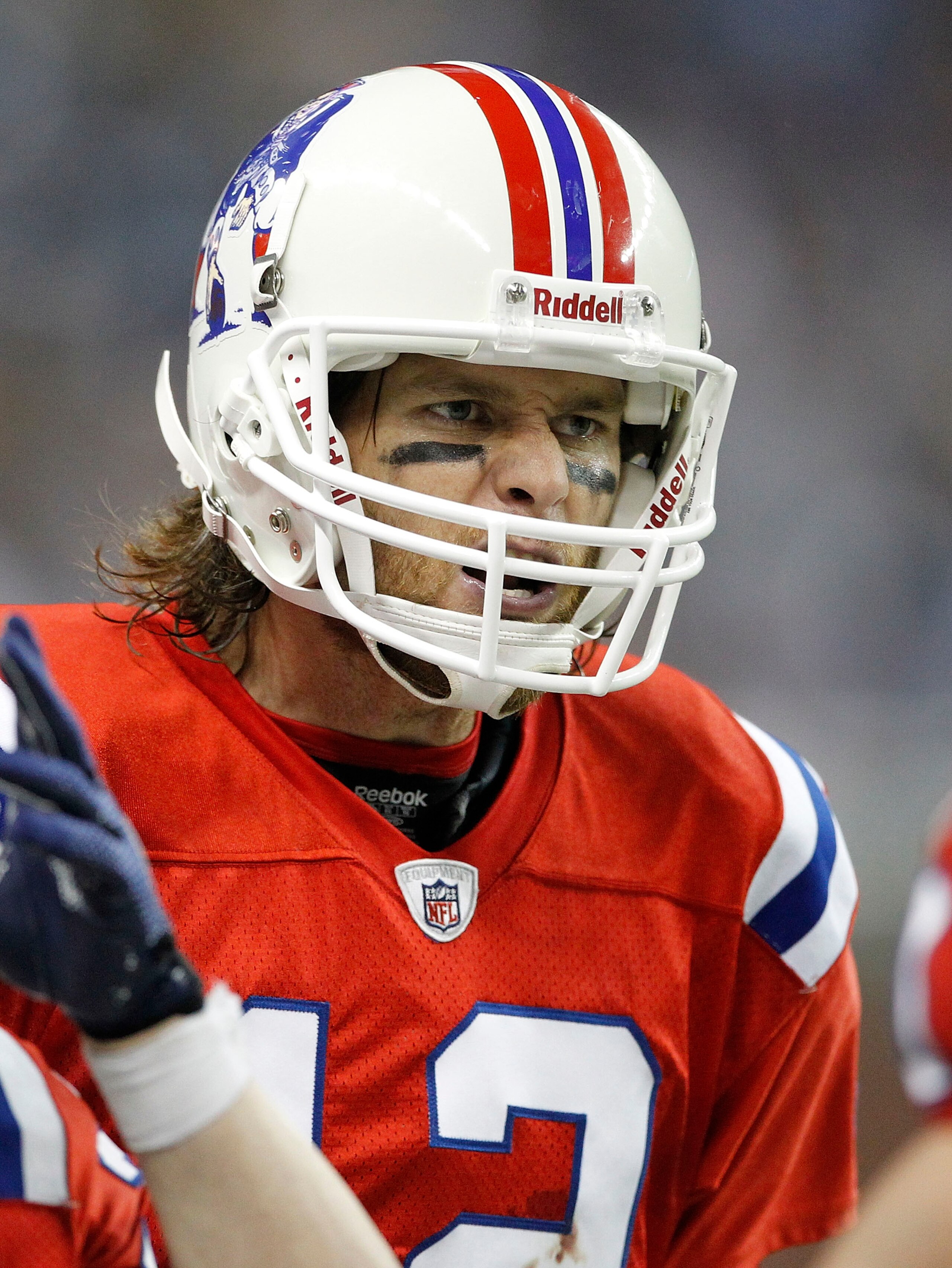 DETROIT - NOVEMBER 25:  Tom Brady #12 of the New England Patriots reacts after a Detroit Lions turnover during the game against the Detroit Lions at Ford Field on November 25, 2010 in Detroit, Michigan. New England defeated Detroit 45-24.  (Photo by Leon