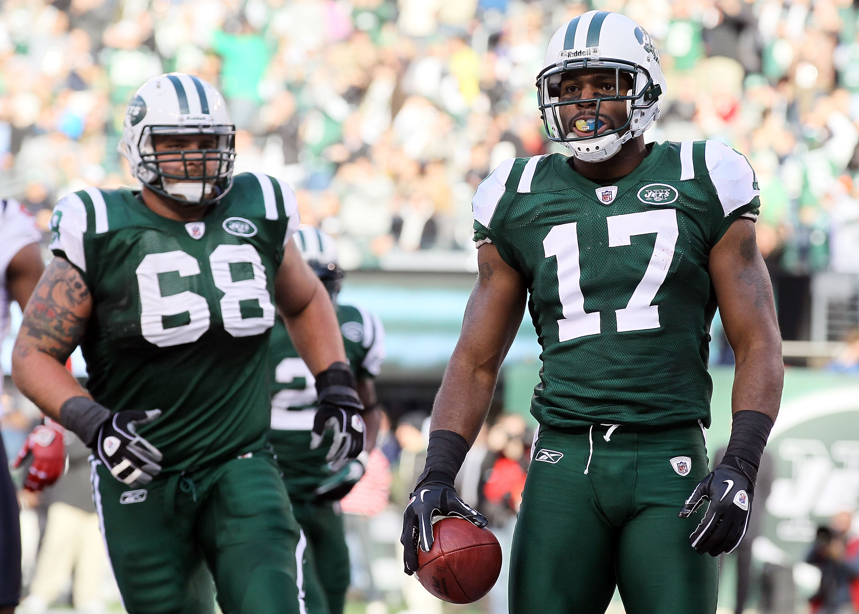 EAST RUTHERFORD, NJ - NOVEMBER 21: Braylon Edwards #17 of the New York Jets looks on after scoring a touchdown agianst the Houston Texans as teammate Matt Saluson #68 looks on November 21, 2010 at the New Meadowlands Stadium in East Rutherford, New Jersey