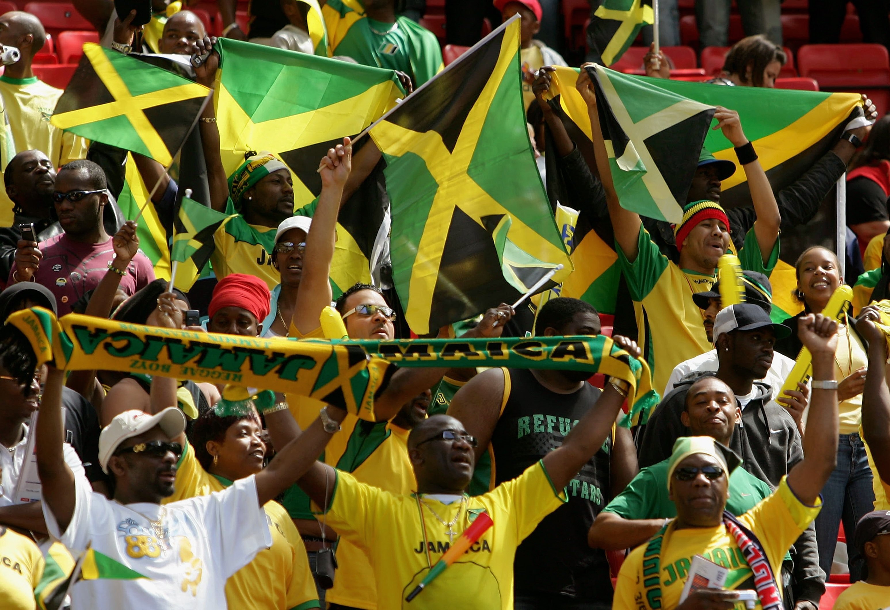 MANCHESTER, UNITED KINGDOM - JUNE 03:  Jamaican Fans cheer on their team during the International Friendly between England and Jamaica at Old Trafford on June 3, 2006 in Manchester, England.  (Photo by Gary M. Prior/Getty Images)