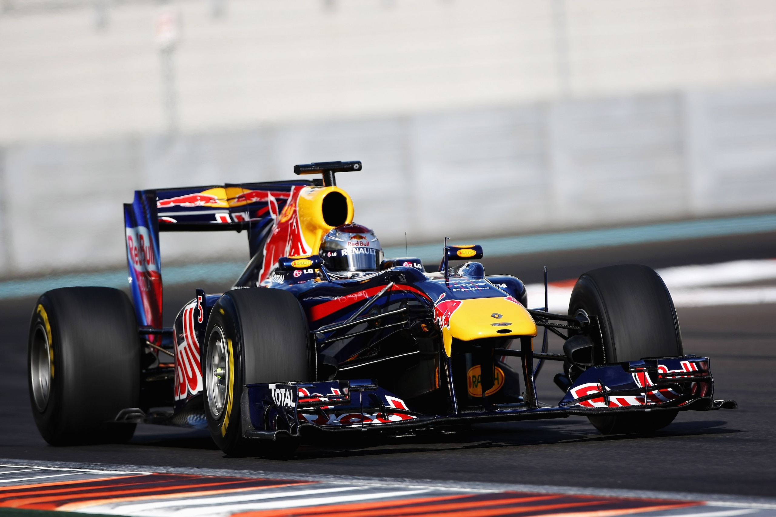 ABU DHABI, UNITED ARAB EMIRATES - NOVEMBER 19: Sebastian Vettel of Germany and Red Bull Racing in action during the Formula 1 Pirelli Tyre Testing at the Yas Marina Circuit on November 19, 2010 in Abu Dhabi, United Arab Emirates. (Photo by Andrew Hone/Get