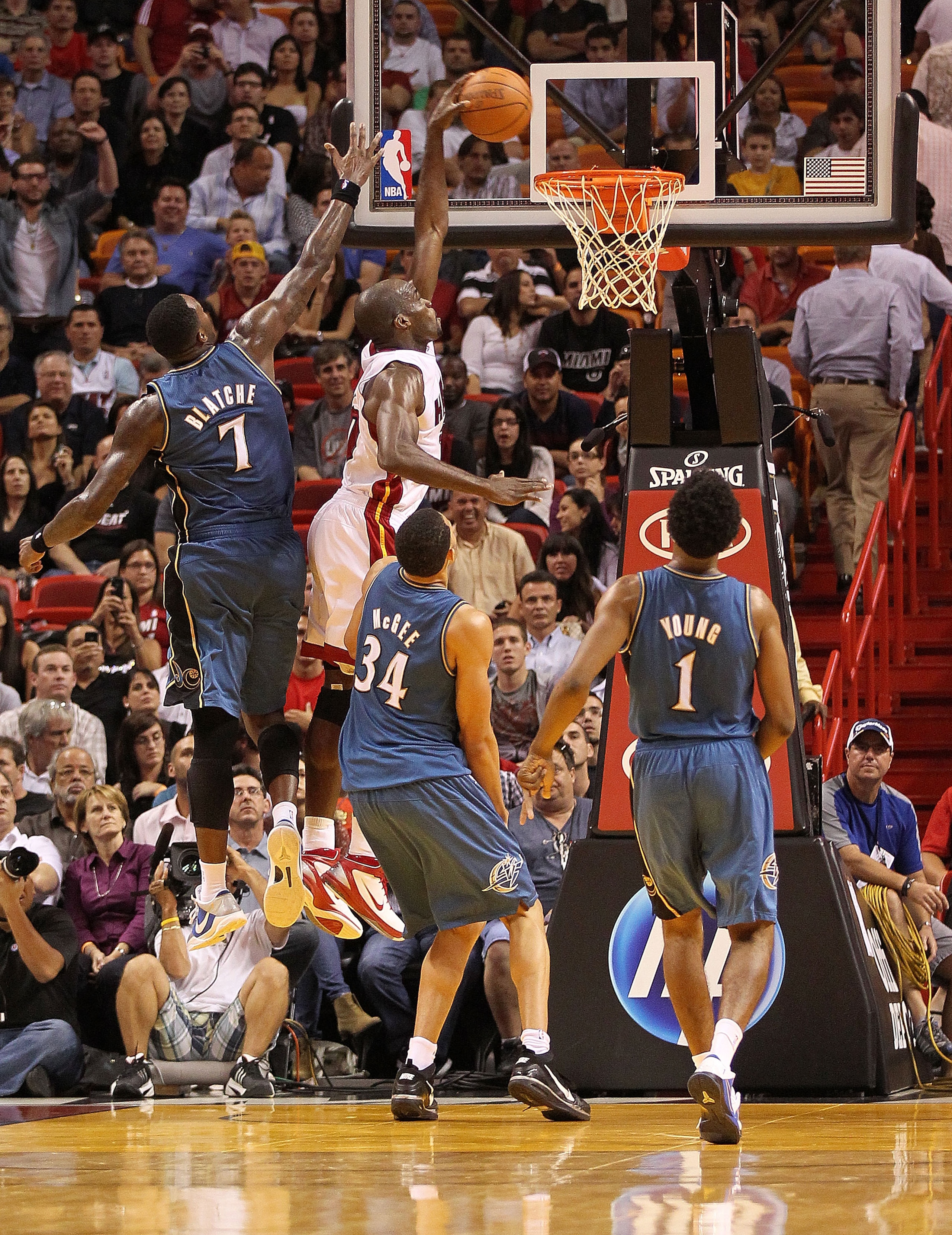 MIAMI, FL - NOVEMBER 29:  Joel Anthony #50 of the Miami Heat dunks over Andray Blatche #7 of the Washington Wizards during a game at American Airlines Arena on November 29, 2010 in Miami, Florida. NOTE TO USER: User expressly acknowledges and agrees that,
