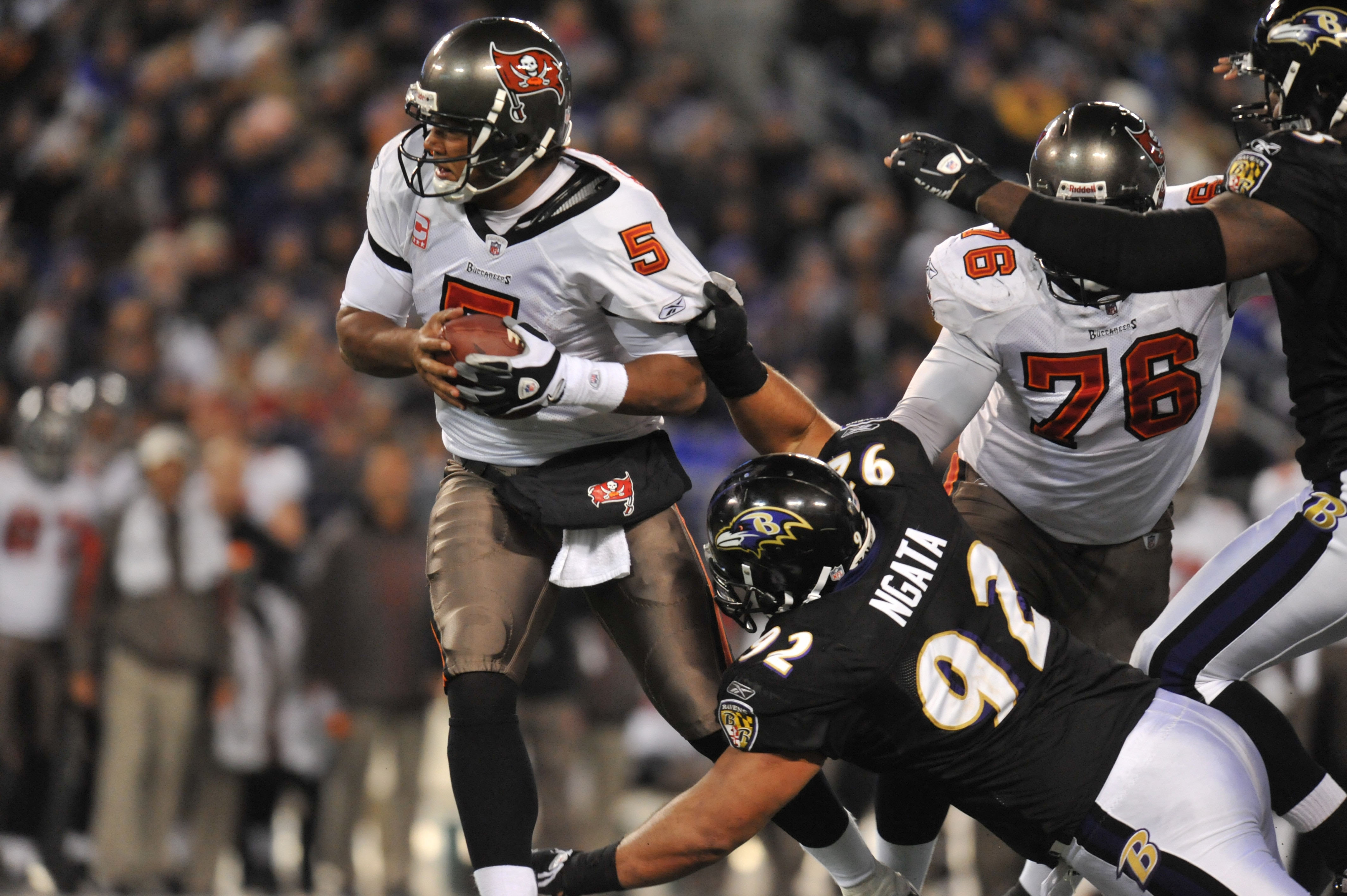 BALTIMORE, MD - NOVEMBER 28:  Josh Freeman #5 of the Tampa Bay Buccaneers is almost sacked by Haloti Ngata #92 of the Baltimore Ravens at M&T Bank Stadium on November 28, 2010 in Baltimore, Maryland. The Ravens defeated the Buccaneers 17-10. (Photo by Lar