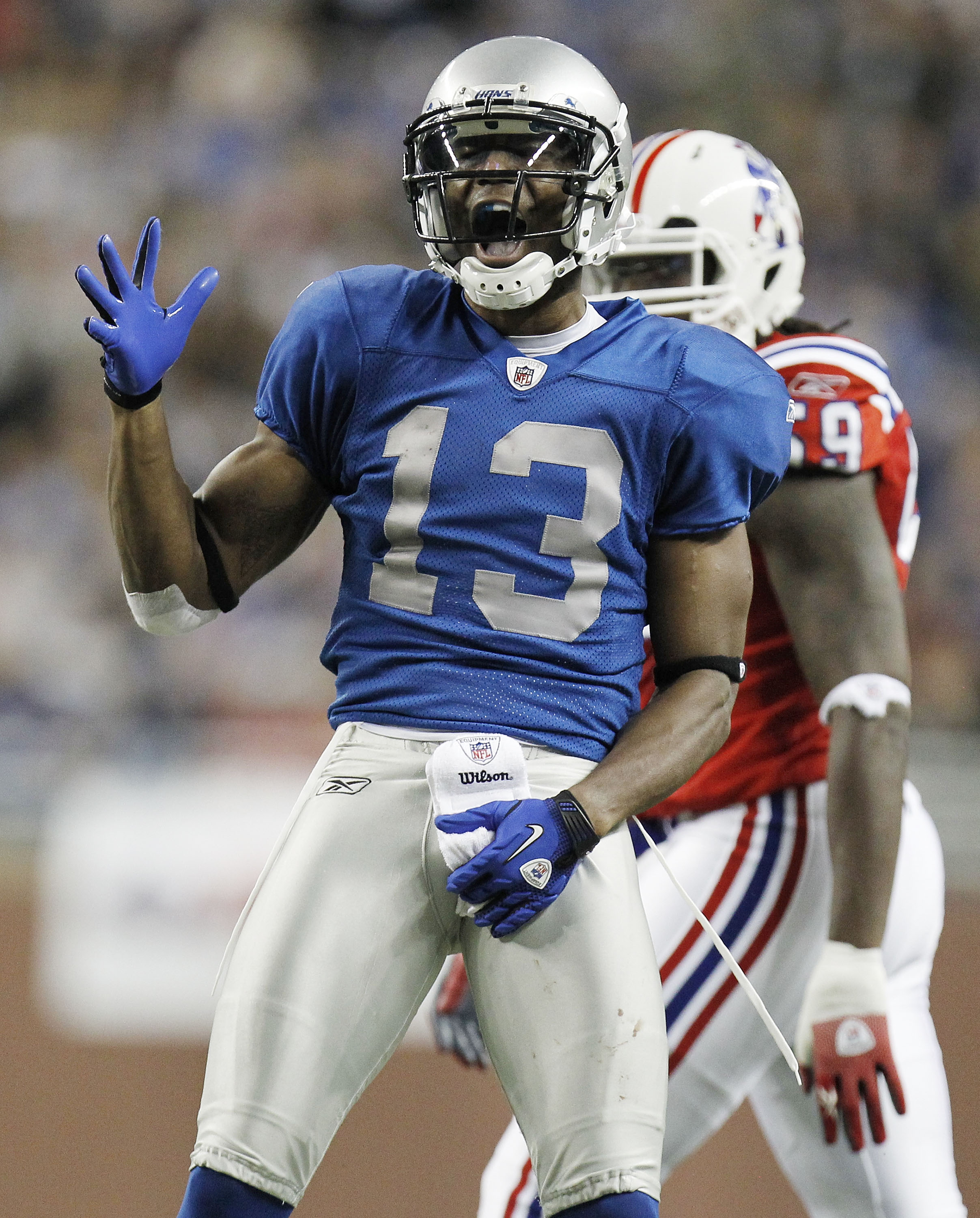 DETROIT - NOVEMBER 25:  Nate Burleson #13 of the Detroit Lions reacts after catching a first down pass while playing the New England Patriots on November 25, 2010 at Ford Field in Detroit, Michigan.  (Photo by Gregory Shamus/Getty Images)