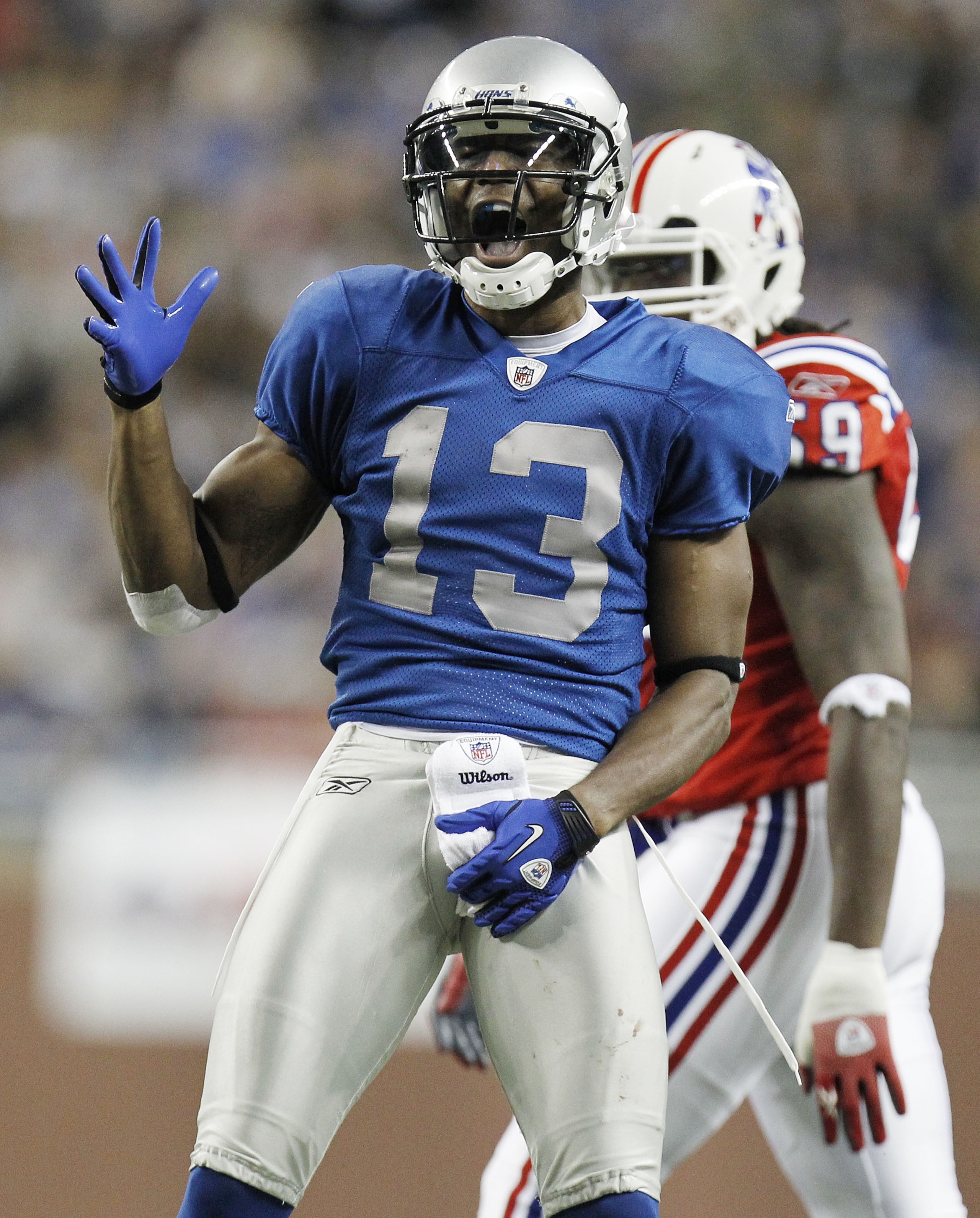 DETROIT - NOVEMBER 25:  Nate Burleson #13 of the Detroit Lions reacts after catching a first down pass while playing the New England Patriots on November 25, 2010 at Ford Field in Detroit, Michigan.  (Photo by Gregory Shamus/Getty Images)