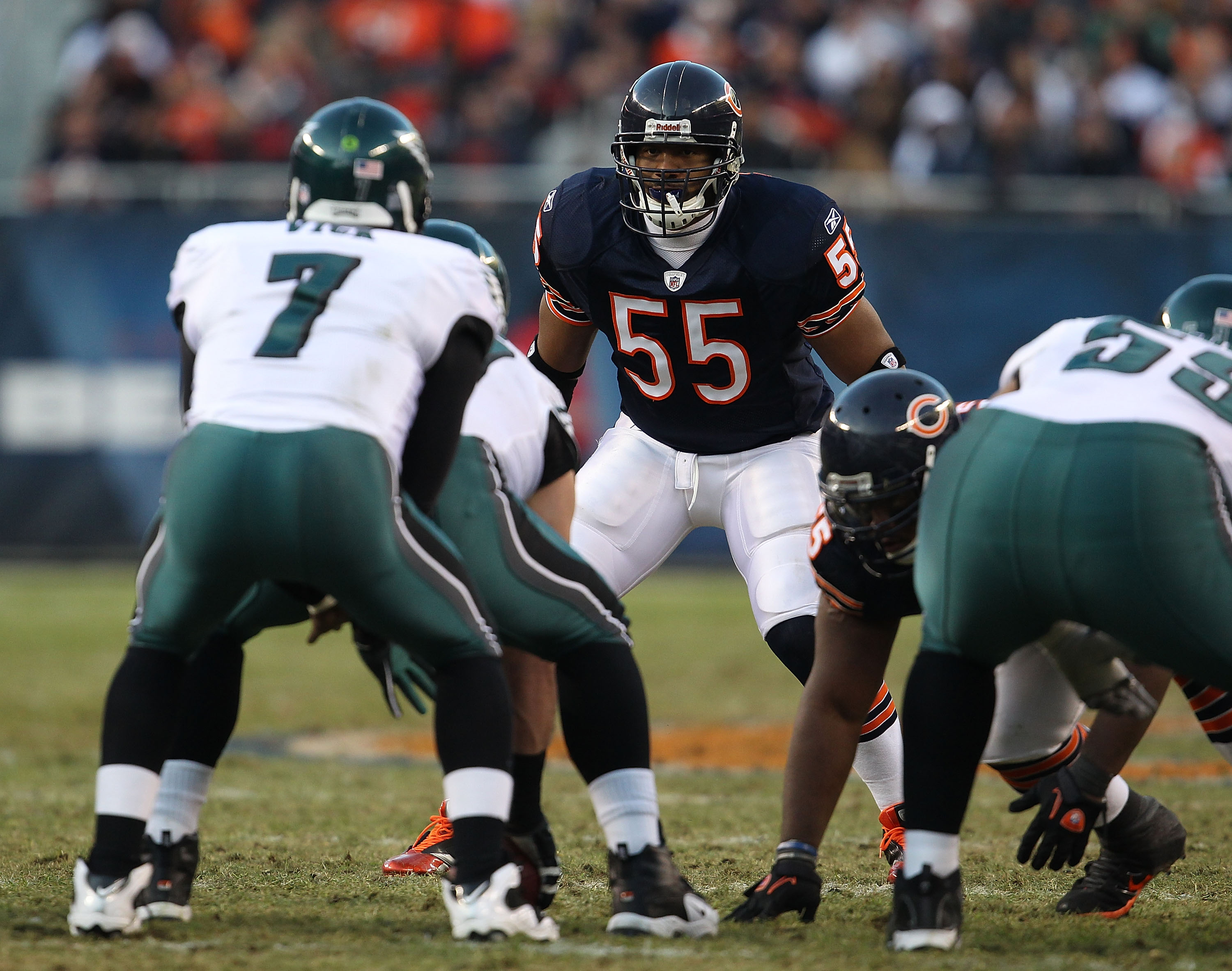 CHICAGO - NOVEMBER 28: Lance Briggs #55 of the Chicago Bears awaits the start of play as Michael Vick #7 of the Philadelphia Eagles calls the signals at Soldier Field on November 28, 2010 in Chicago, Illinois. The Bears defeated the Eagles 31-26. (Photo b