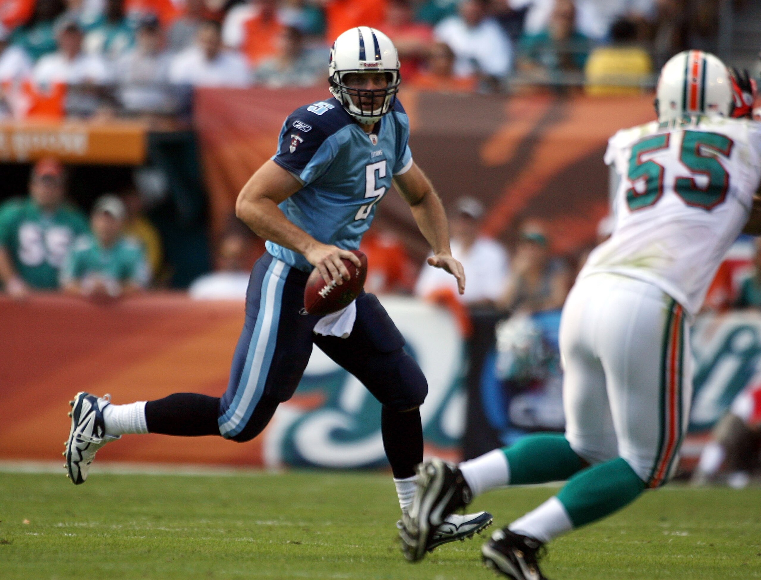 MIAMI - NOVEMBER 14:  Quarterback Kerry Collins #5 of the Tennessee Titans runs against the Miami Dolphins at Sun Life Stadium on November 14, 2010 in Miami, Florida.  (Photo by Marc Serota/Getty Images)