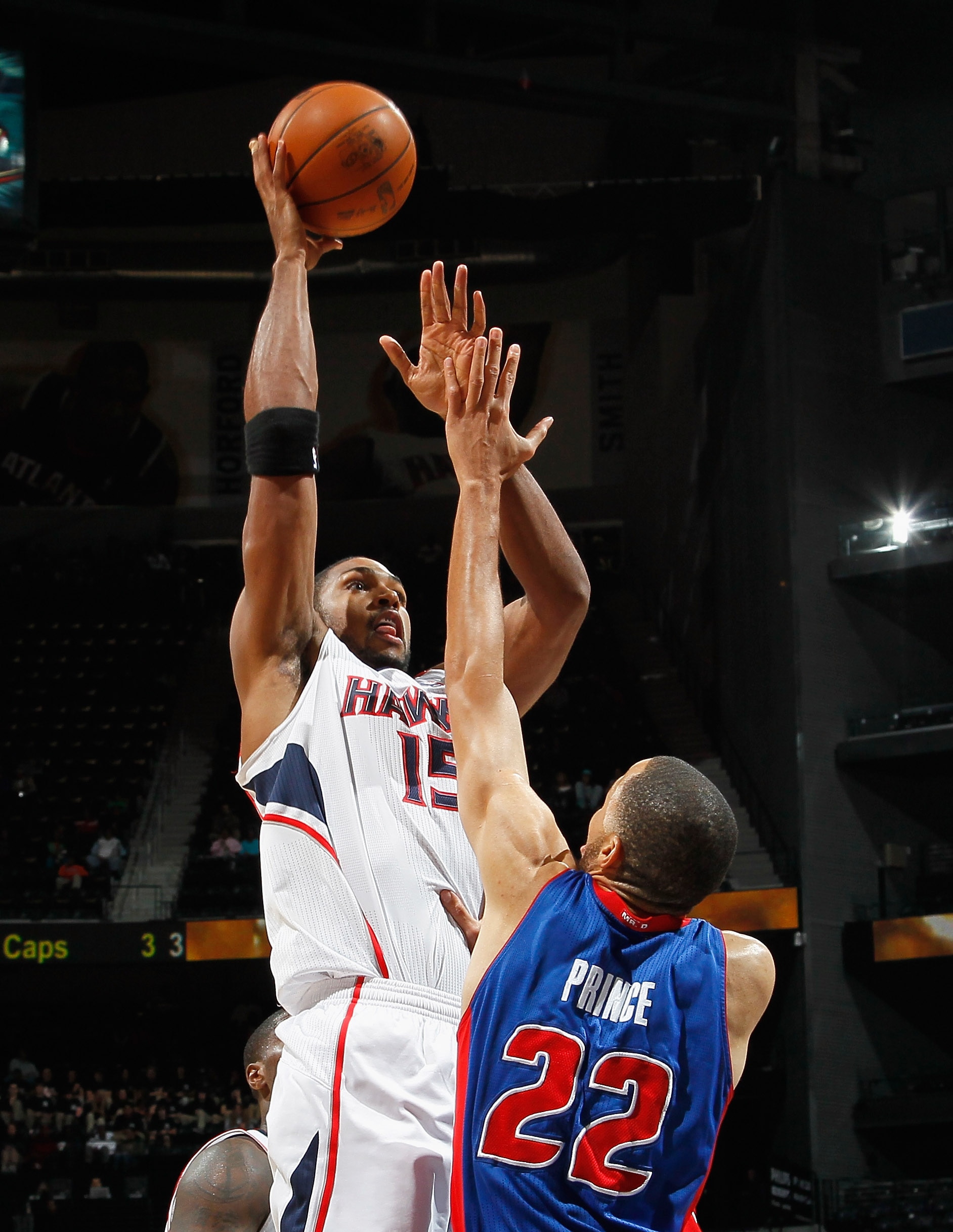 ATLANTA - NOVEMBER 03:  Al Horford #15 of the Atlanta Hawks against Tayshaun Prince #22 of the Detroit Pistons at Philips Arena on November 3, 2010 in Atlanta, Georgia.  NOTE TO USER: User expressly acknowledges and agrees that, by downloading and/or usin