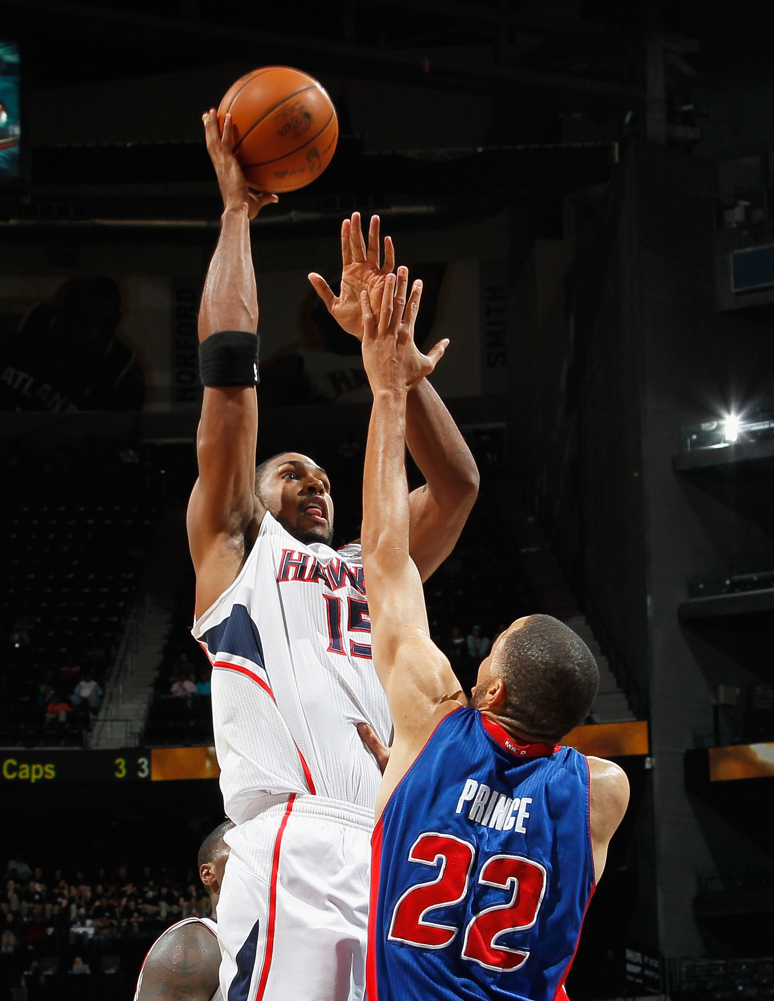 ATLANTA - NOVEMBER 03:  Al Horford #15 of the Atlanta Hawks against Tayshaun Prince #22 of the Detroit Pistons at Philips Arena on November 3, 2010 in Atlanta, Georgia.  NOTE TO USER: User expressly acknowledges and agrees that, by downloading and/or usin
