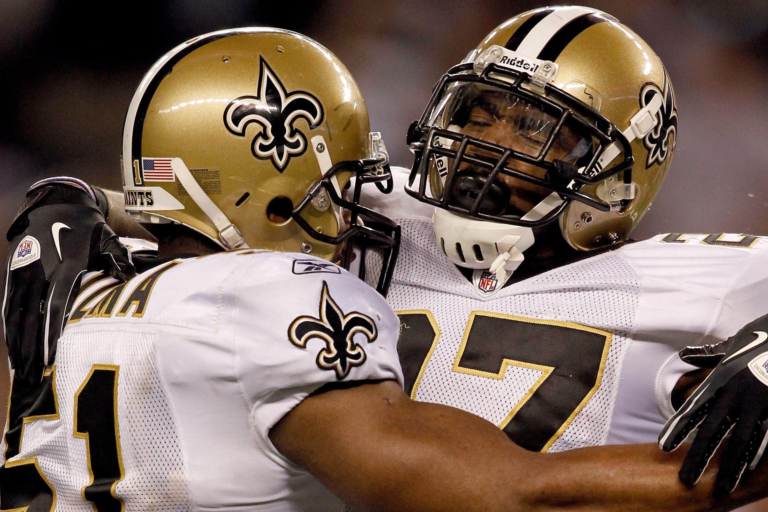 ARLINGTON, TX - NOVEMBER 25: Jonathan Vilma #51 of the New Orleans Saints congratulates Malcolm Jenkins #27 after stripping the ball for a fumble recovery late in the fourth quarter against the Dallas Cowboys at Cowboys Stadium on November 25, 2010 in Arl